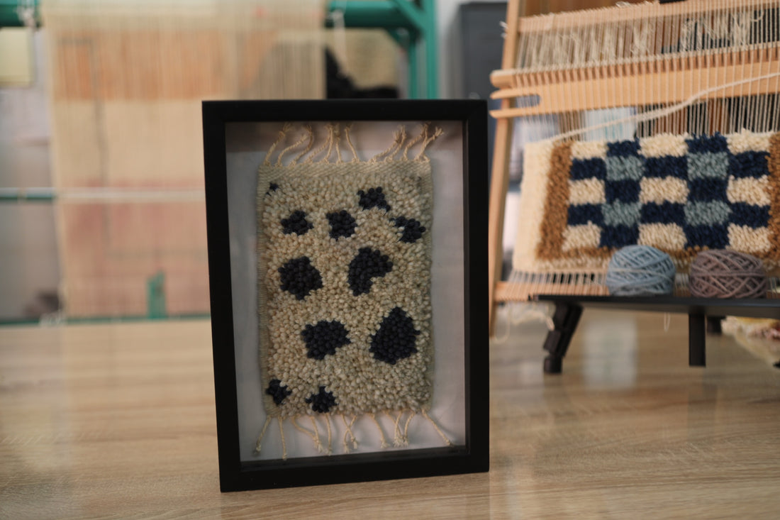 Framed Handmade Moroccan Rug Art – Cream Wool with Black Dots – Berber Textile Wall Hanging – Modern Boho Decor