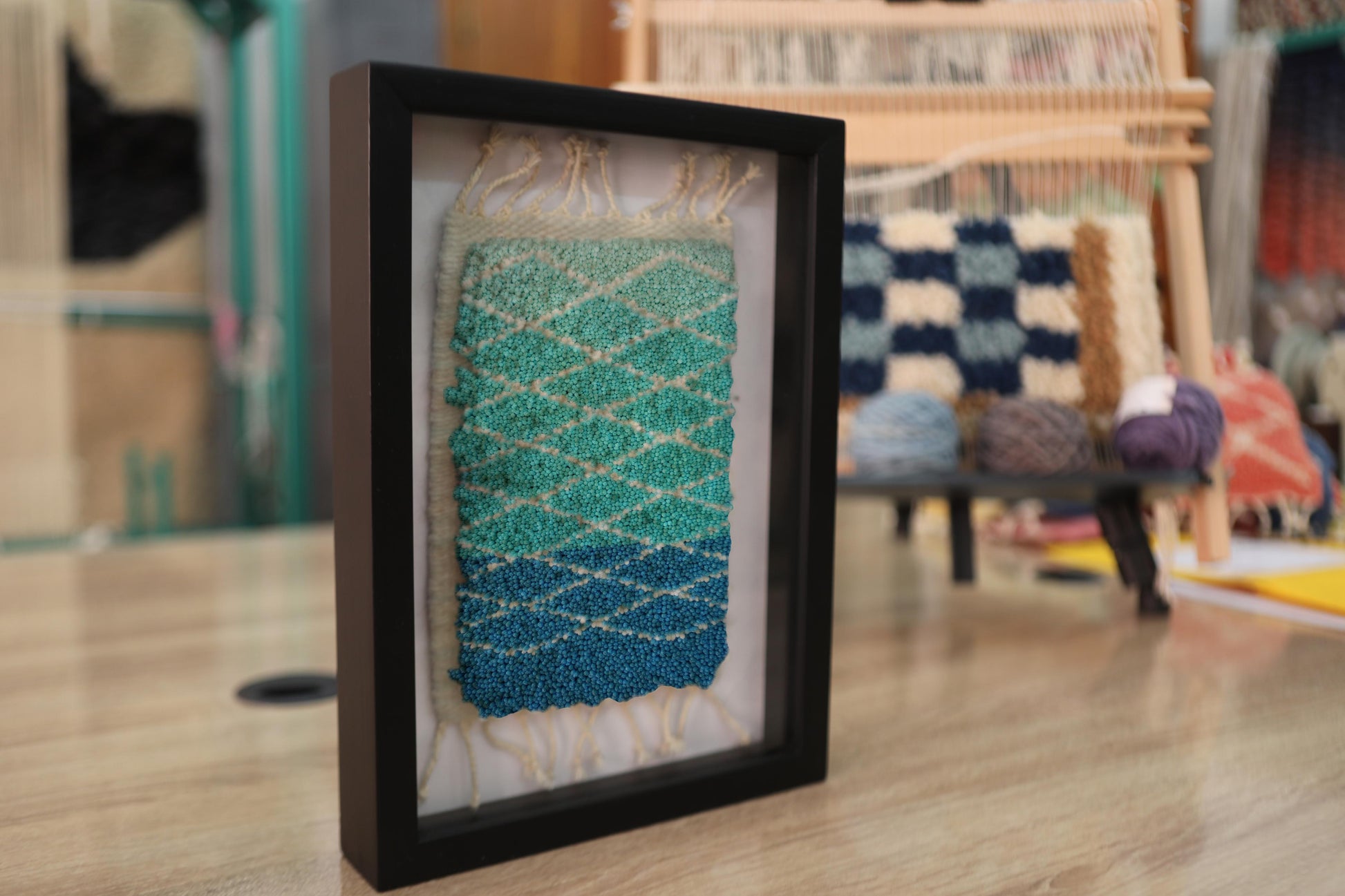 blue green gradient rug, diamond pattern moroccan rug, hand-knotted wool wall art, framed moroccan textile, artisan woven rug, small moroccan rug decor, ombre rug art, knot by knot weaving, boho wall hanging, 25x31 cm moroccan art
