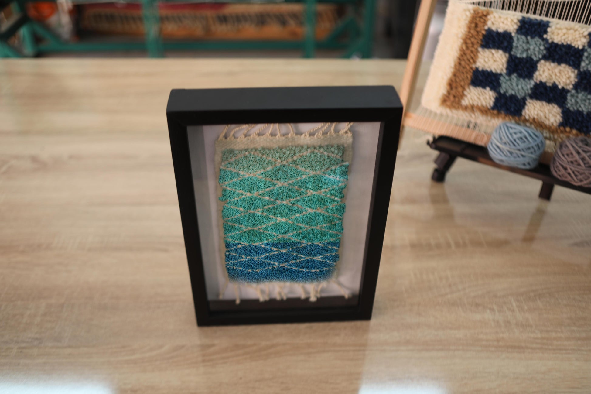 blue green gradient rug, diamond pattern moroccan rug, hand-knotted wool wall art, framed moroccan textile, artisan woven rug, small moroccan rug decor, ombre rug art, knot by knot weaving, boho wall hanging, 25x31 cm moroccan art
