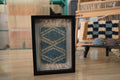 blue moroccan rug wall art, framed wool tapestry, large diamond moroccan pattern, knot by knot wall decor, hand-knotted moroccan wool rug, artisan mini rug framed, moroccan textile wall hanging, boho framed wool art, small moroccan framed rug, geometric blue moroccan wall art
