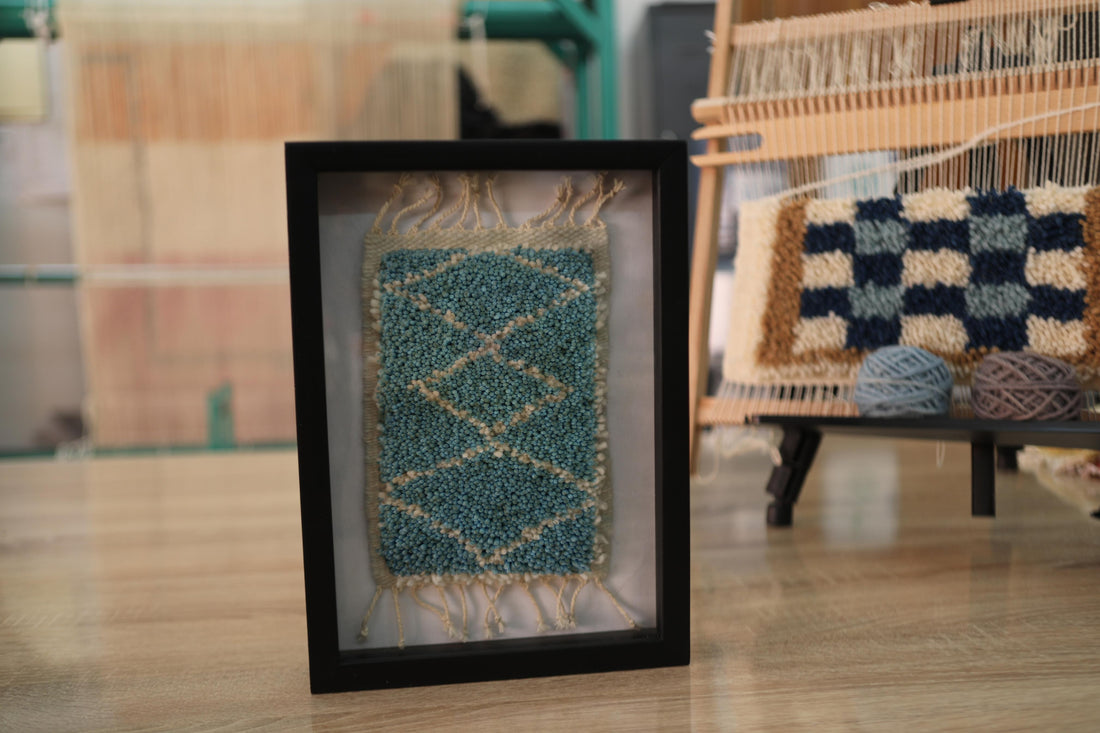 central diamond moroccan rug, framed wool moroccan rug art, moroccan rug wall hanging, mini wool moroccan carpet, hand-knotted small moroccan rug, bohemian framed textile art, artisan moroccan rug decor, 25x31 cm rug artwork, knot by knot rug wall decor, moroccan wall tapestry blue
