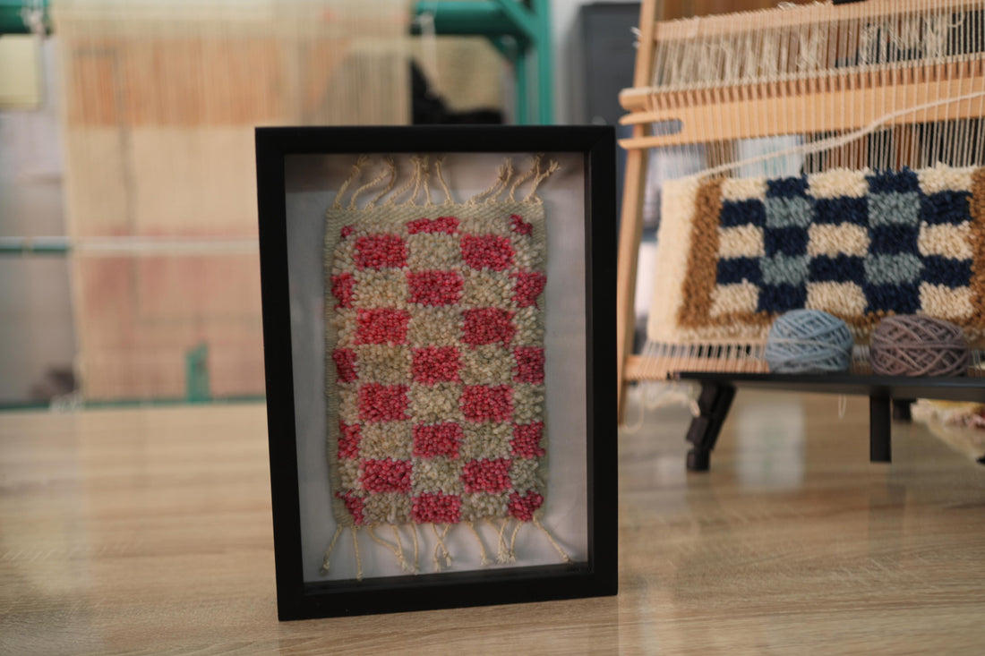 checkerboard moroccan rug, red and cream mini rug, hand-knotted wool rug, mini moroccan textile art, framed moroccan wall decor, wool checker pattern, artisan rug morocco, moroccan rug 25x31 cm, wool wall hanging, boho moroccan decor
