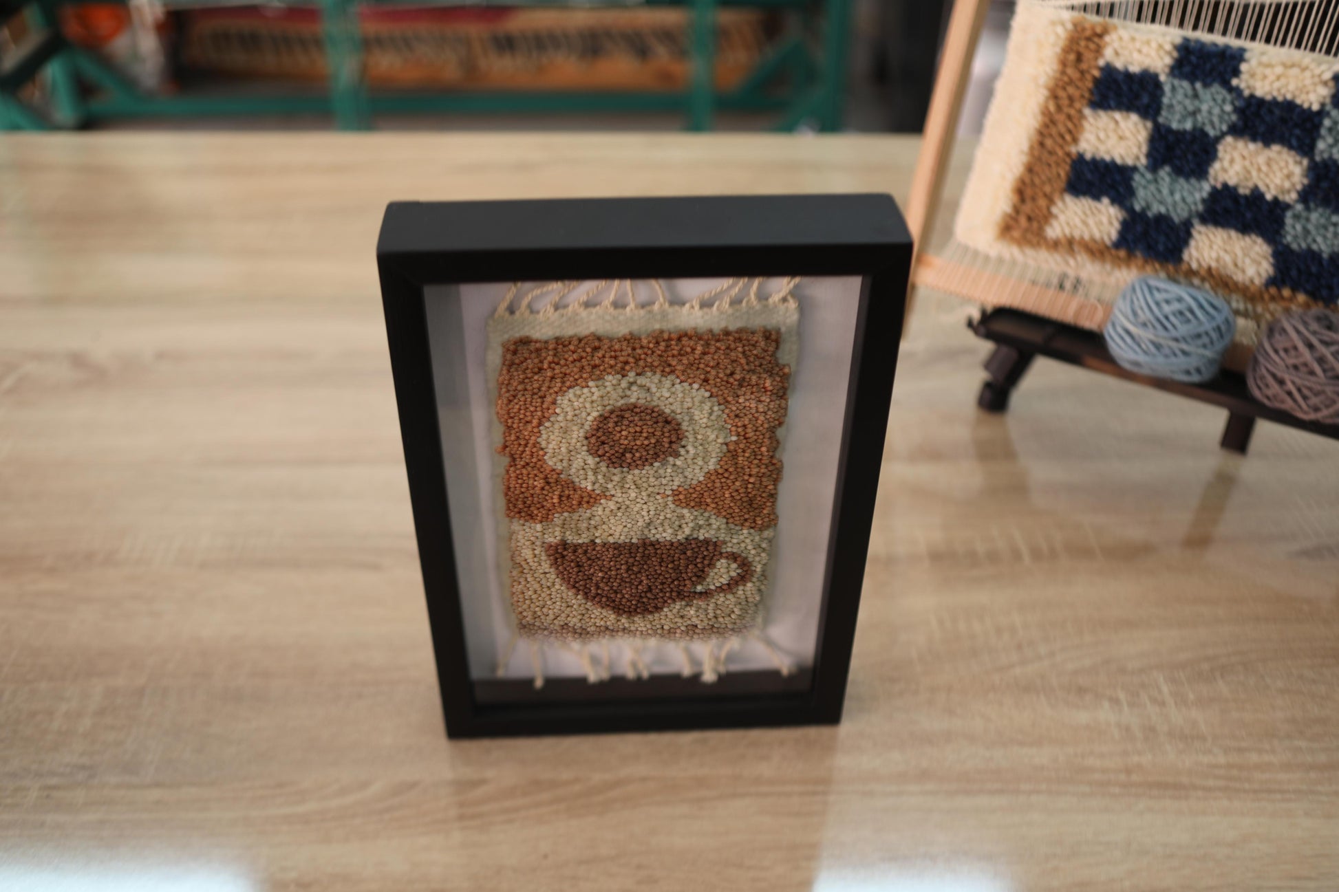 coffee cup wall art, moroccan rug, steam swirl coffee design, hand knotted wool art, knot by knot tapestry, coffee mug decor, café wall hanging, warm earth tones textile, 25x31 cm wool framed rug, artisan rug artwork
