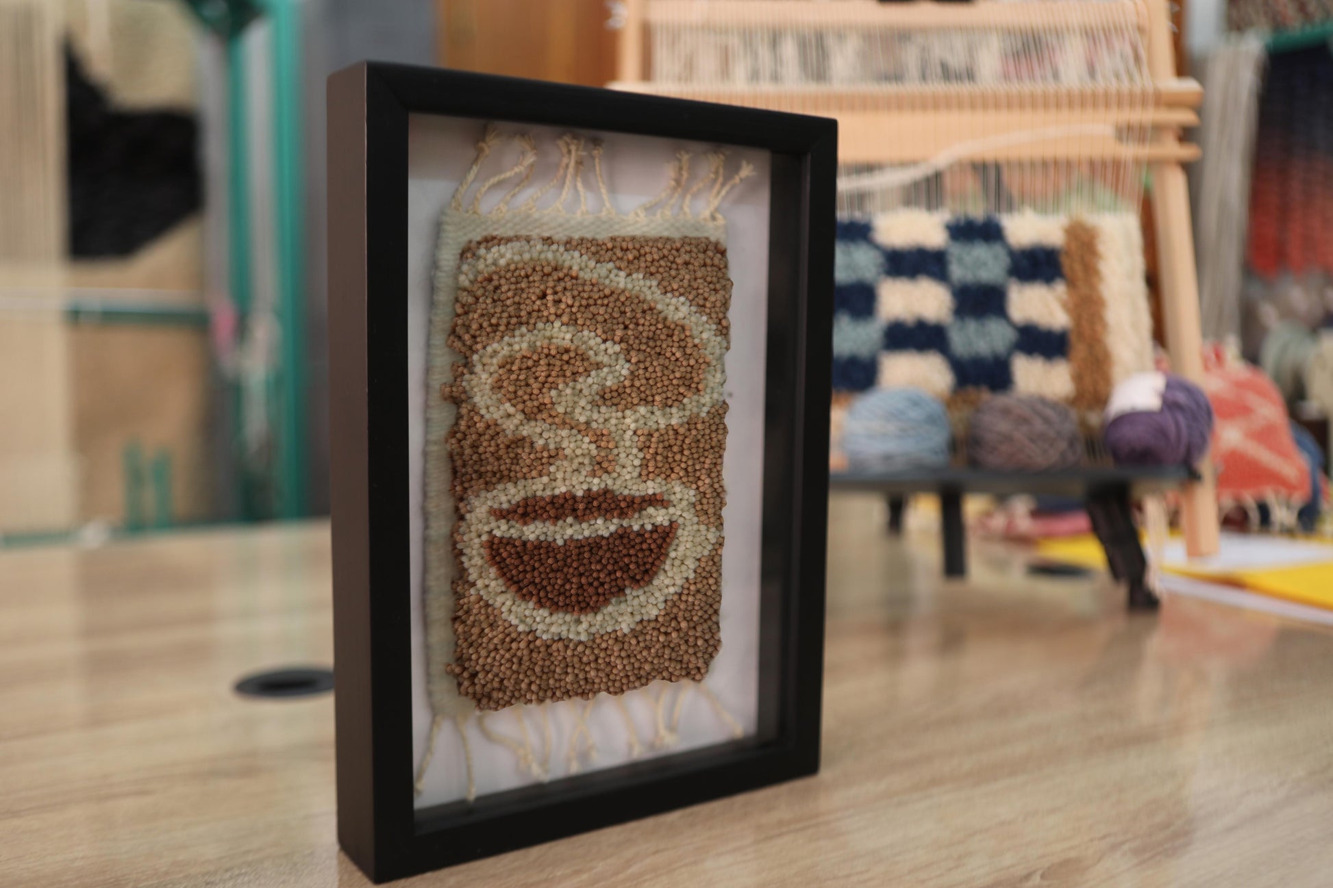 coffee steam rug, abstract coffee art, moroccan rug wall decor, hand knotted wool art, cozy kitchen wall hanging, bohemian framed textile, knot by knot moroccan rug, steam swirl wool tapestry, artisan coffee decor, 25x31 cm framed rug
