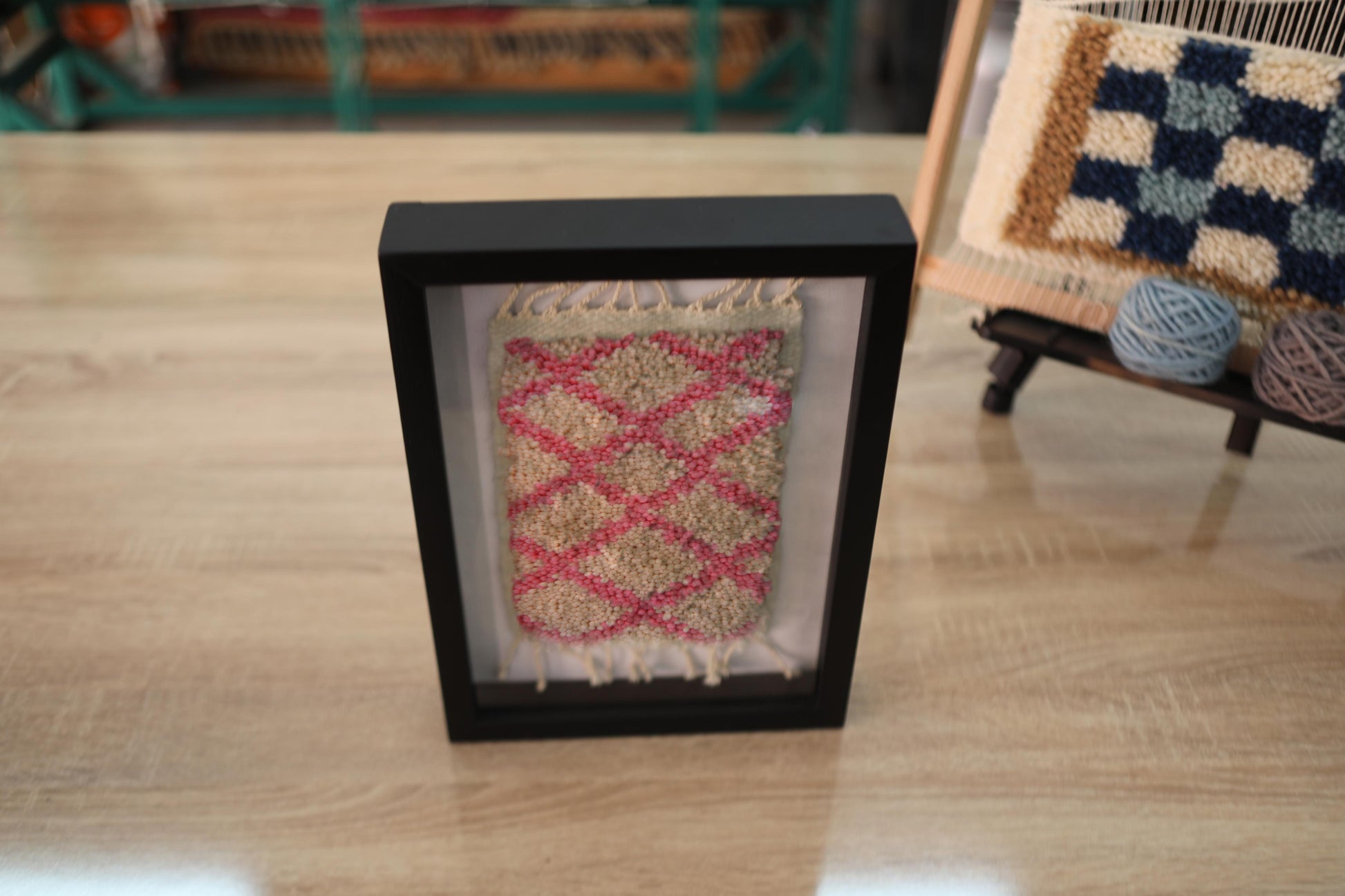 diamond pattern moroccan rug, hand knotted wool rug, mini moroccan wall art, pink cream framed rug, boho moroccan decor, artisan wall textile, traditional moroccan weaving, moroccan rug 25x31 cm, knot by knot rug, berber rug miniature, handmade wool wall piece
