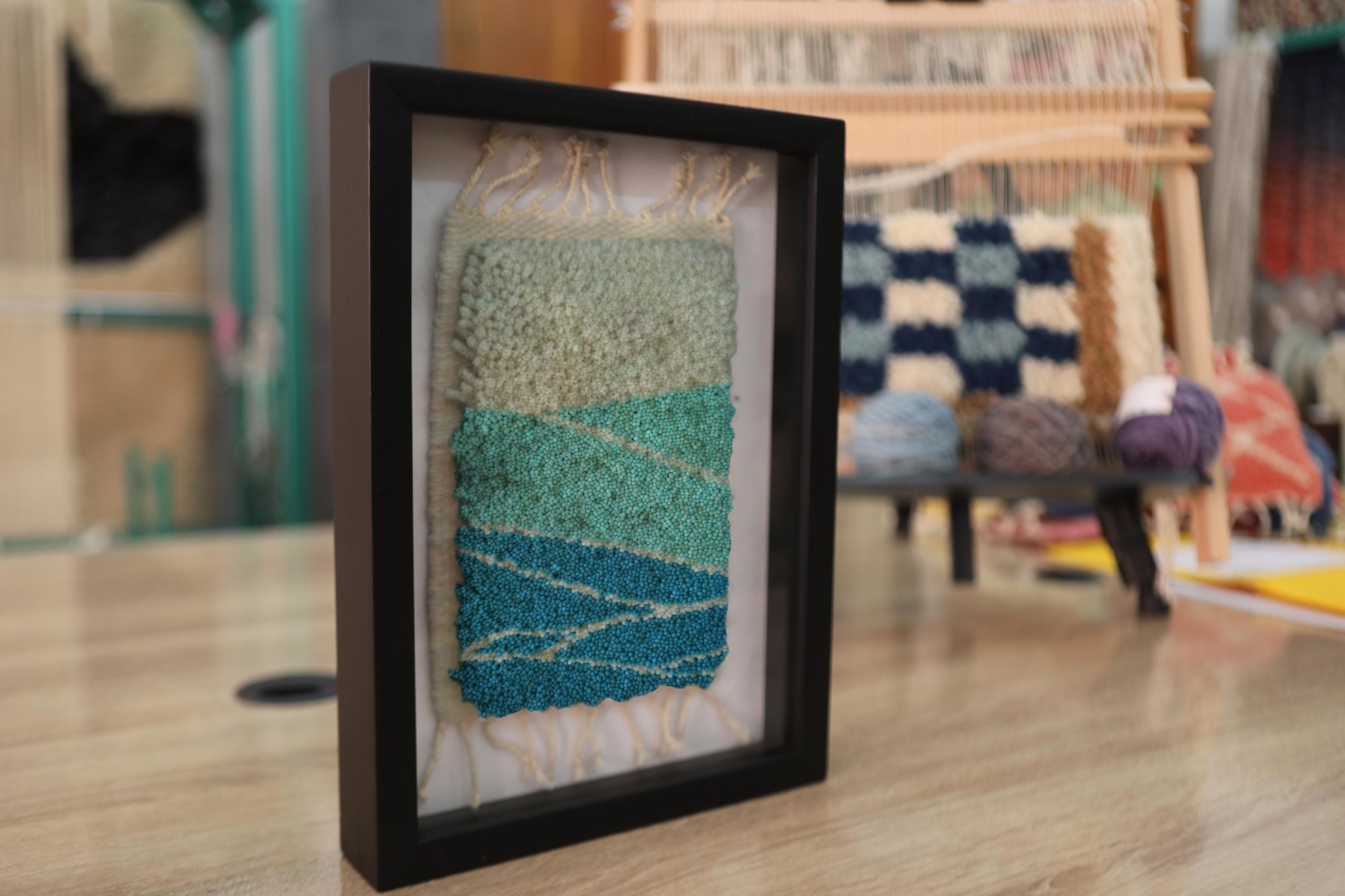 layered horizon rug, moroccan rug, framed wall art, wool wall hanging, sand blue green textile art, moroccan handmade decor, ocean desert rug, knot by knot, artisan wall rug, minimal rug landscape
