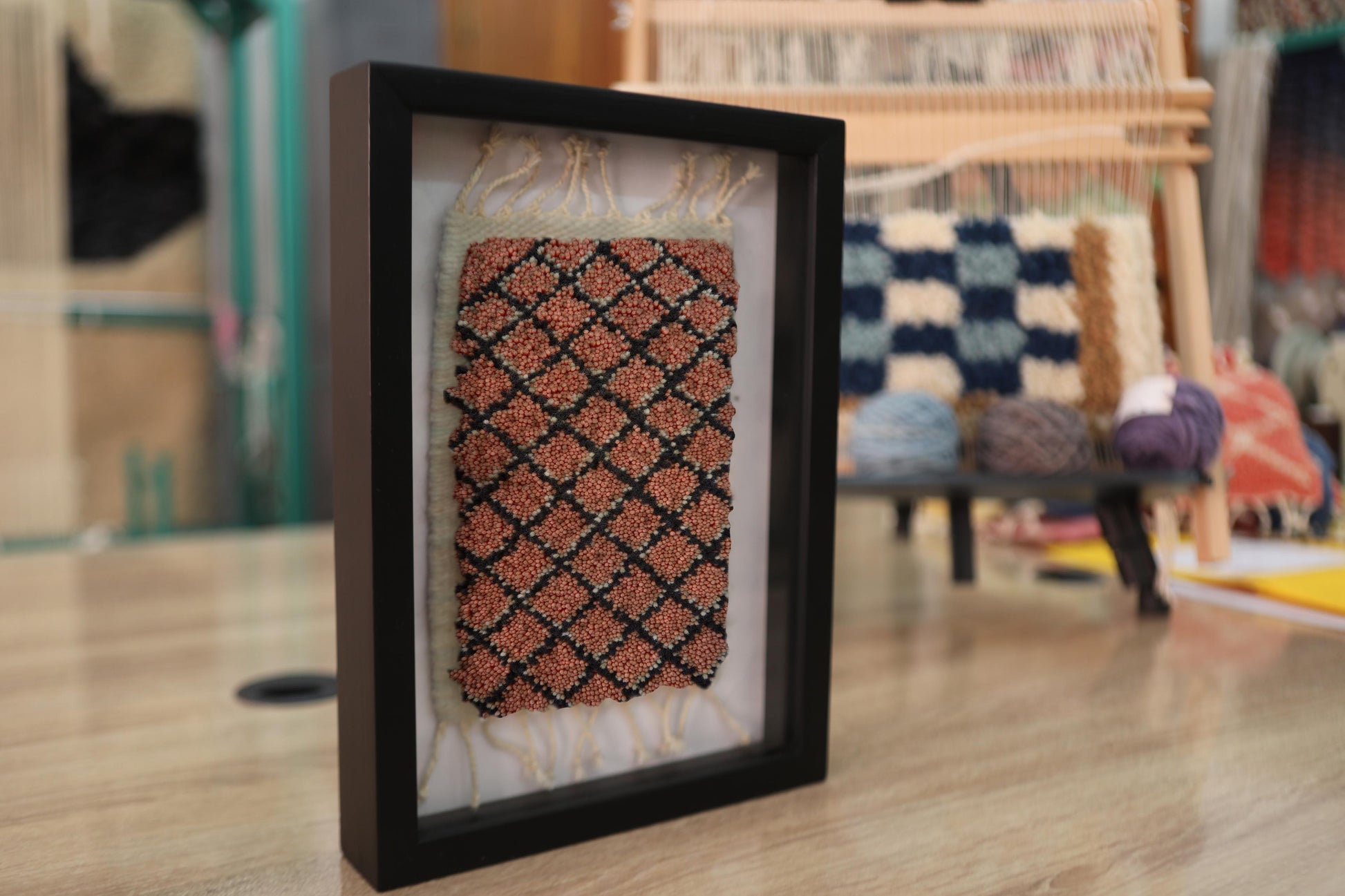 moroccan rug, coral and black rug, framed textile art, handmade moroccan rug, mini rug wall hanging, berber pattern, hand-knotted moroccan rug, artisan weaving, wool rug decor, knot by knot rug
