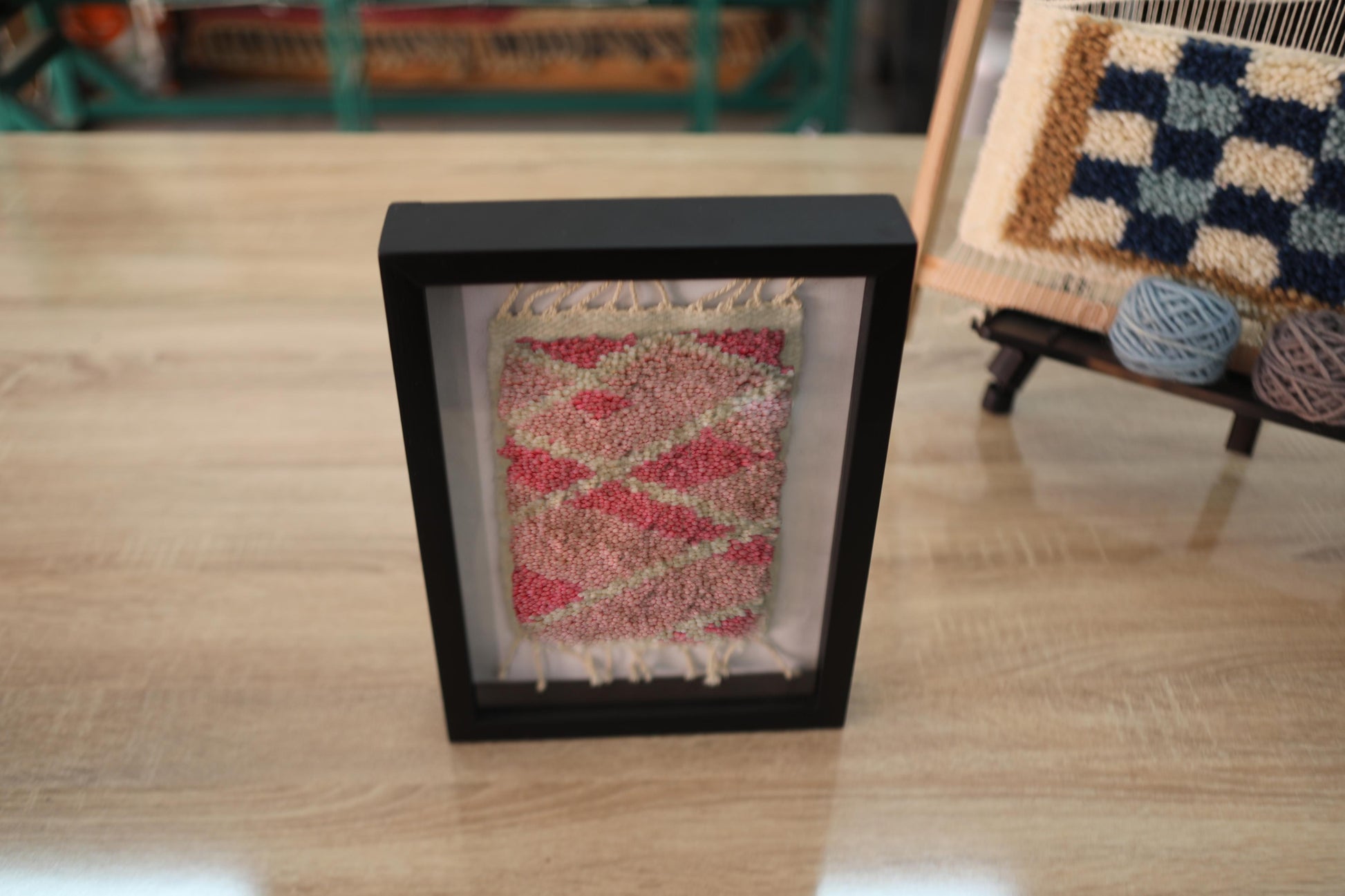 moroccan rug, diamond pattern mini rug, geometric wool wall art, red and green moroccan textile, hand-knotted rug art, framed moroccan decor, small rug wall hanging, knot by knot weaving, boho moroccan art, 25x31 cm rug
