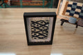 moroccan rug, eye pattern rug, beige and black wool, hand-knotted rug, framed mini rug wall art, traditional moroccan design, knot by knot weaving, artisan textile wall decor, wool wall hanging, berber rug art
