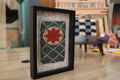 moroccan rug, framed rug art, red star medallion, hand knotted wool rug, wool wall hanging, geometric moroccan textile, moroccan miniature rug, artisan rug design, bohemian decor, traditional moroccan craft
