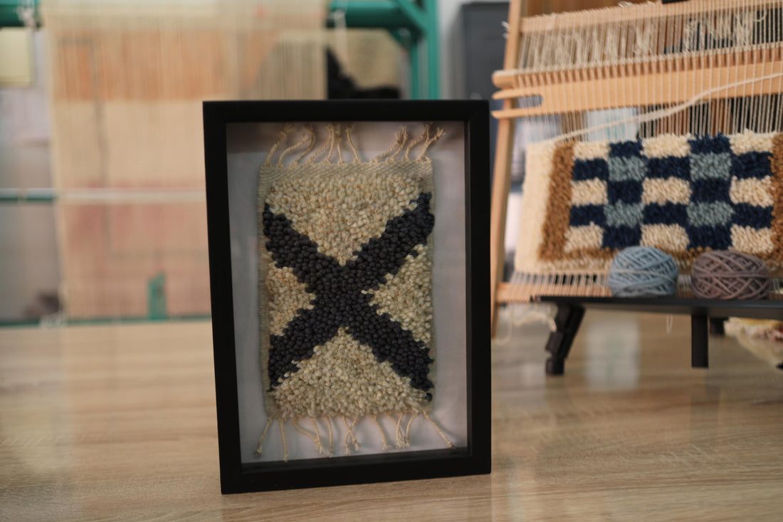 Add character to your wall with this 25x31 cm hand-knotted Moroccan rug featuring a bold black X motif. Framed and ready to hang, each piece is woven knot by knot by Moroccan artisans.
