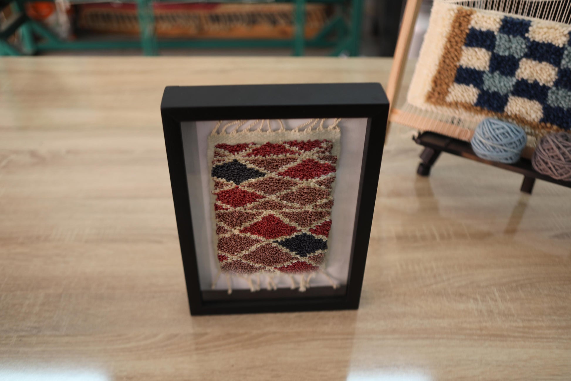 moroccan rug, hand-knotted tapestry, colorful wall art, diamond pattern rug, framed wool artwork, red and navy rug, mini rug decor, artisan moroccan rug, wool wall piece, moroccan home accents
