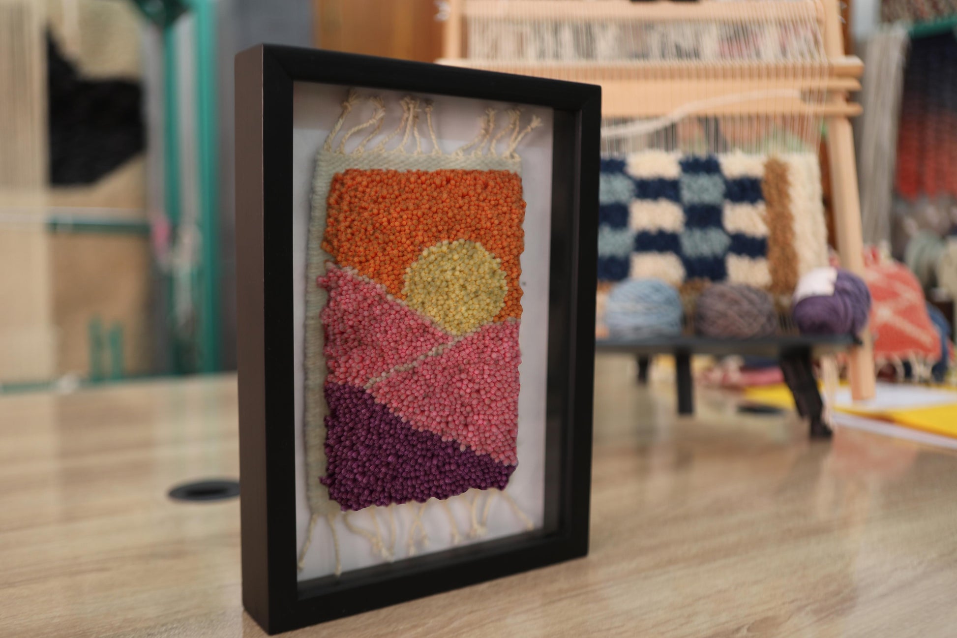 moroccan rug, hand-knotted wall art, geometric sun rug, framed textile art, boho decor piece, artisan wool wall hanging, knot by knot handmade, colorful mini rug art, 25x31 cm
