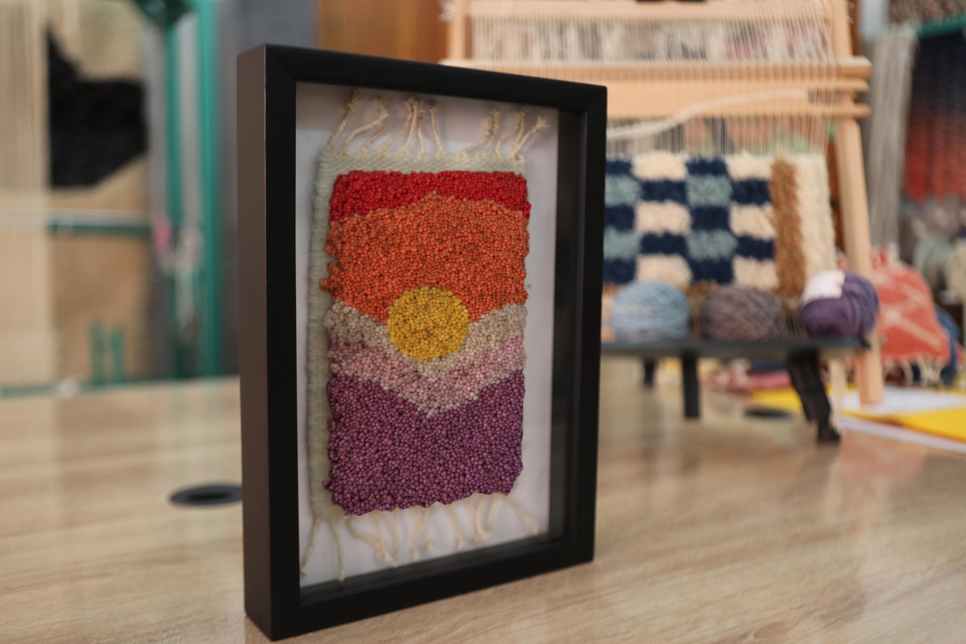 moroccan rug, hand-knotted wall art, sunburst horizon rug, framed boho decor, artisan wool wall hanging, knot by knot handmade, orange red yellow textile art, framed mini rug, 25x31 cm rug art
