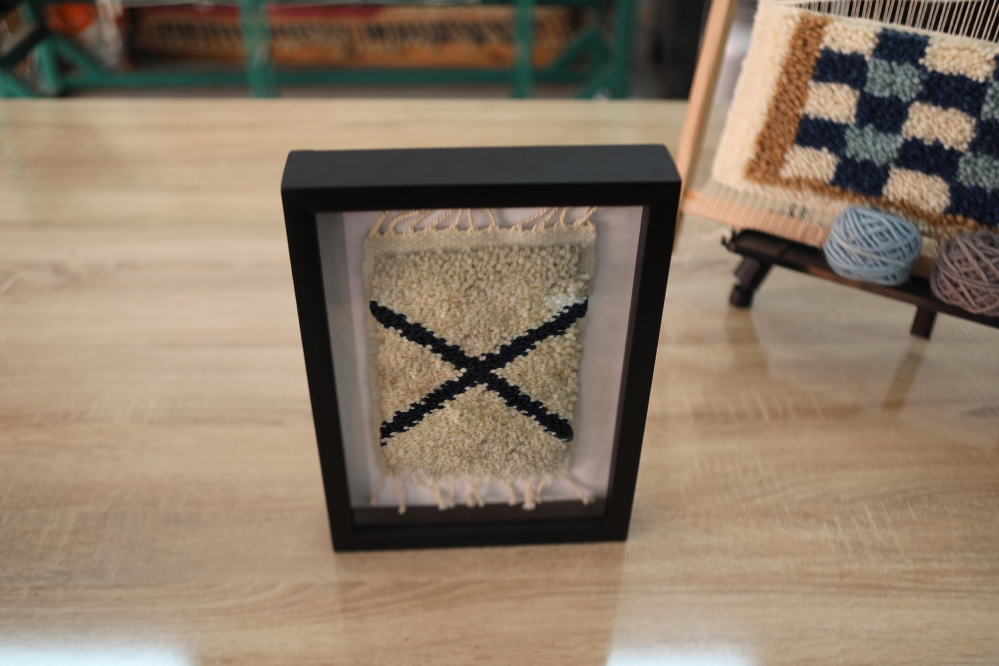 moroccan rug, hand-knotted wall art, x cross rug, tribal textile decor, bohemian framed rug, wool rug art, mini moroccan rug, artisan wall hanging, framed berber rug, black and cream decor
