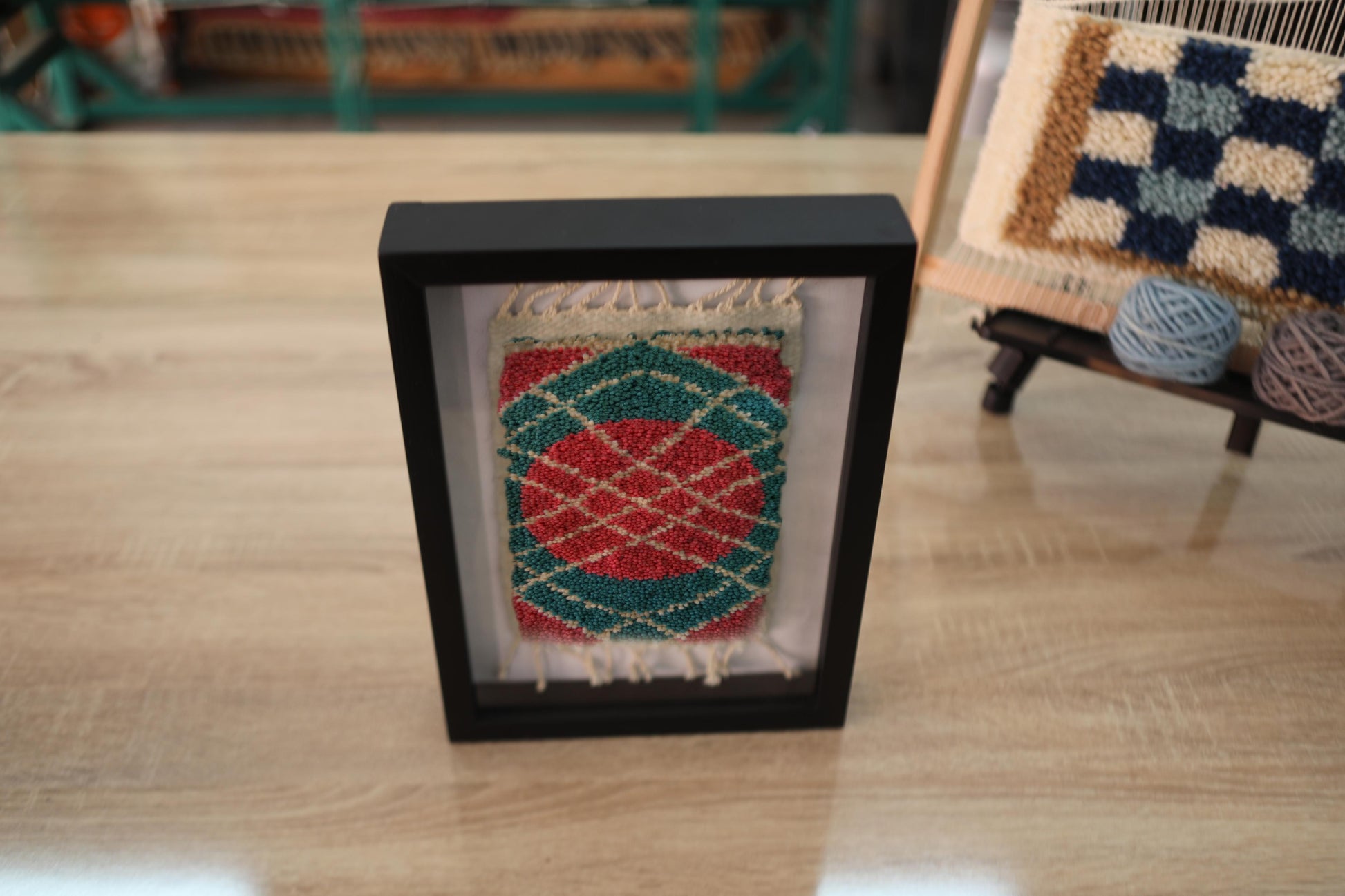moroccan rug, hand-knotted wool, framed mini rug, circular pattern wall art, boho decor, artisan moroccan textile, red green rug, knot by knot rug, wool wall hanging, 25x31 cm rug art
