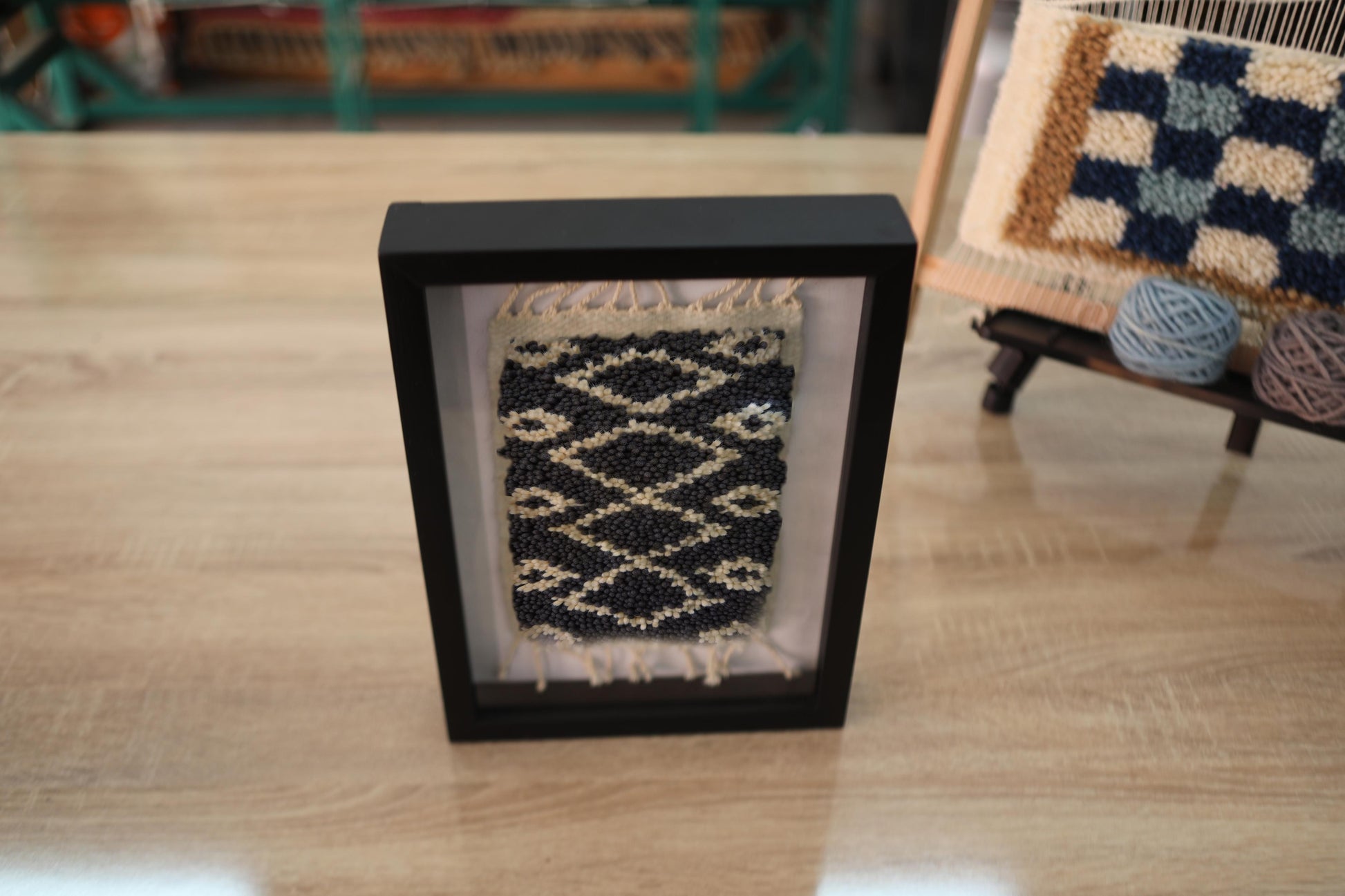 moroccan rug, hand-knotted wool rug, zigzag pattern, diamond motif, black and beige rug, mini rug wall art, framed artisan textile, knot by knot weaving, moroccan wool decor, tribal mini rug

