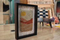 moroccan rug, mountain landscape rug, hand-knotted wool wall art, earth tone mini rug, artisan moroccan tapestry, yellow sun textile, boho moroccan decor, desert mountain wall piece, framed mini moroccan rug, knot by knot weaving, 25x31 cm
