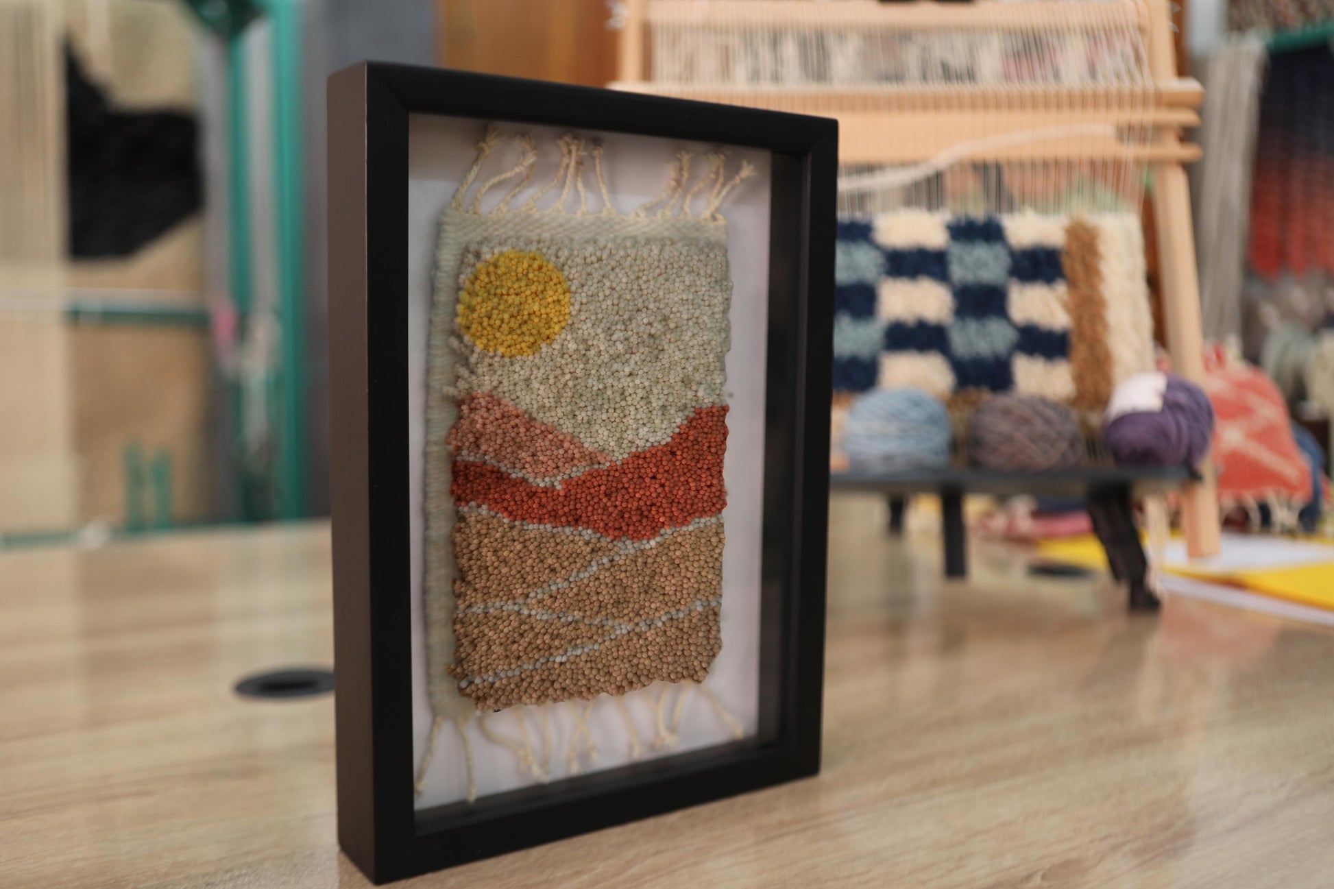 moroccan rug, mountain landscape rug, hand-knotted wool wall art, earth tone mini rug, artisan moroccan tapestry, yellow sun textile, boho moroccan decor, desert mountain wall piece, framed mini moroccan rug, knot by knot weaving, 25x31 cm
