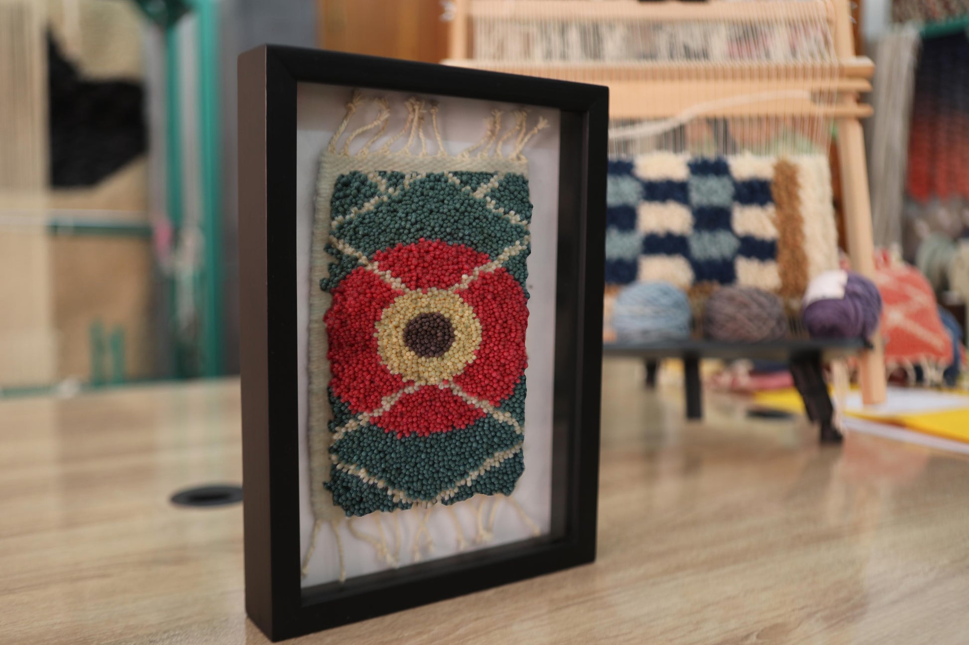 moroccan rug, red flower rug, framed wool tapestry, hand knotted rug art, green wall decor, artisan rug weaving, knot by knot textile, mini moroccan wall hanging, floral rug design
