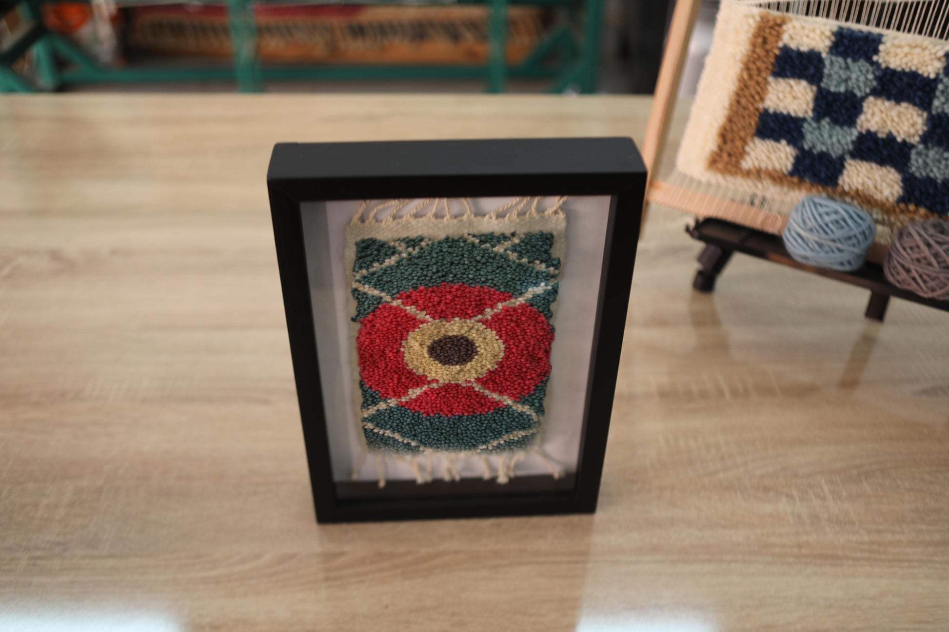 moroccan rug, red flower rug, framed wool tapestry, hand knotted rug art, green wall decor, artisan rug weaving, knot by knot textile, mini moroccan wall hanging, floral rug design
