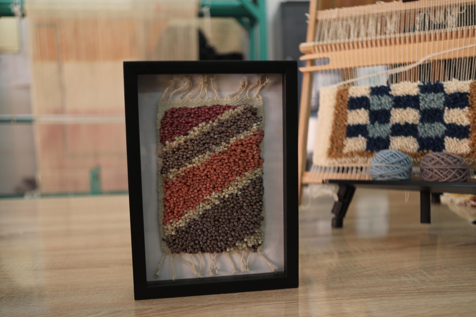 moroccan rug, striped rug wall art, hand-knotted textile, framed moroccan rug, earthy colors decor, boho wool wall hanging, diagonal pattern, knot by knot weaving, small rug art, moroccan wool decor
