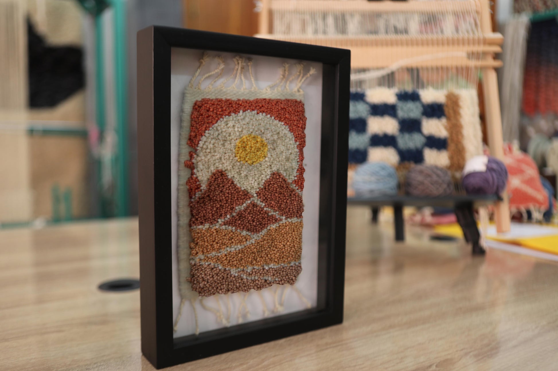 moroccan rug, sunburst wall art, hand-knotted tapestry, wool landscape rug, framed fiber art, desert textile art, handmade moroccan decor, knot by knot weaving, 25x31 cm rug art, boho wall hanging, modern moroccan wall art, earth tone wool rug
