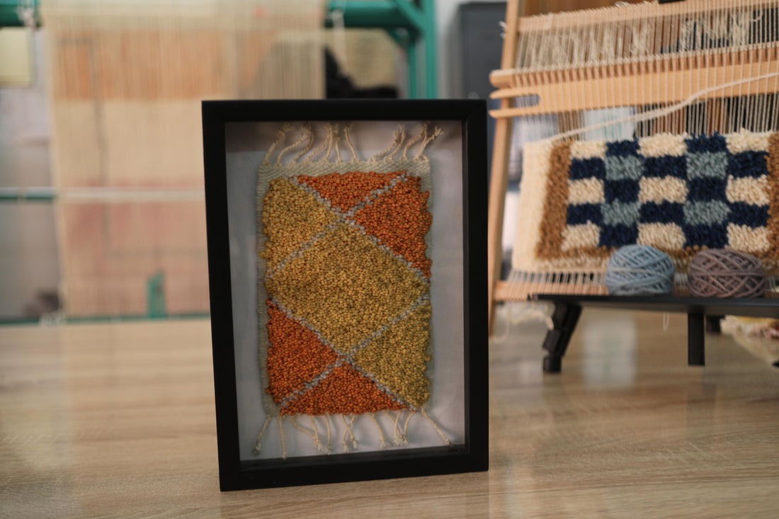moroccan rug diamond pattern, geometric wool wall art, hand knotted mini rug, framed moroccan textile, orange and yellow moroccan art, boho rug wall hanging, artisan moroccan wool tapestry, knot by knot moroccan rug, earthy home decor, 25x31 cm framed rug

