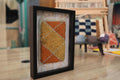 moroccan rug diamond pattern, geometric wool wall art, hand knotted mini rug, framed moroccan textile, orange and yellow moroccan art, boho rug wall hanging, artisan moroccan wool tapestry, knot by knot moroccan rug, earthy home decor, 25x31 cm framed rug
