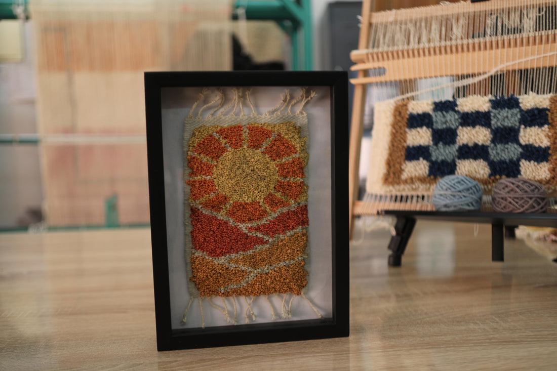 moroccan rug sun design, sunrise rug wall art, desert landscape textile, framed wool moroccan mini rug, boho sun pattern decor, handmade moroccan wool art, knot by knot rug, artisan moroccan wall hanging, earthy wool tapestry, 25x31 cm moroccan framed rug
