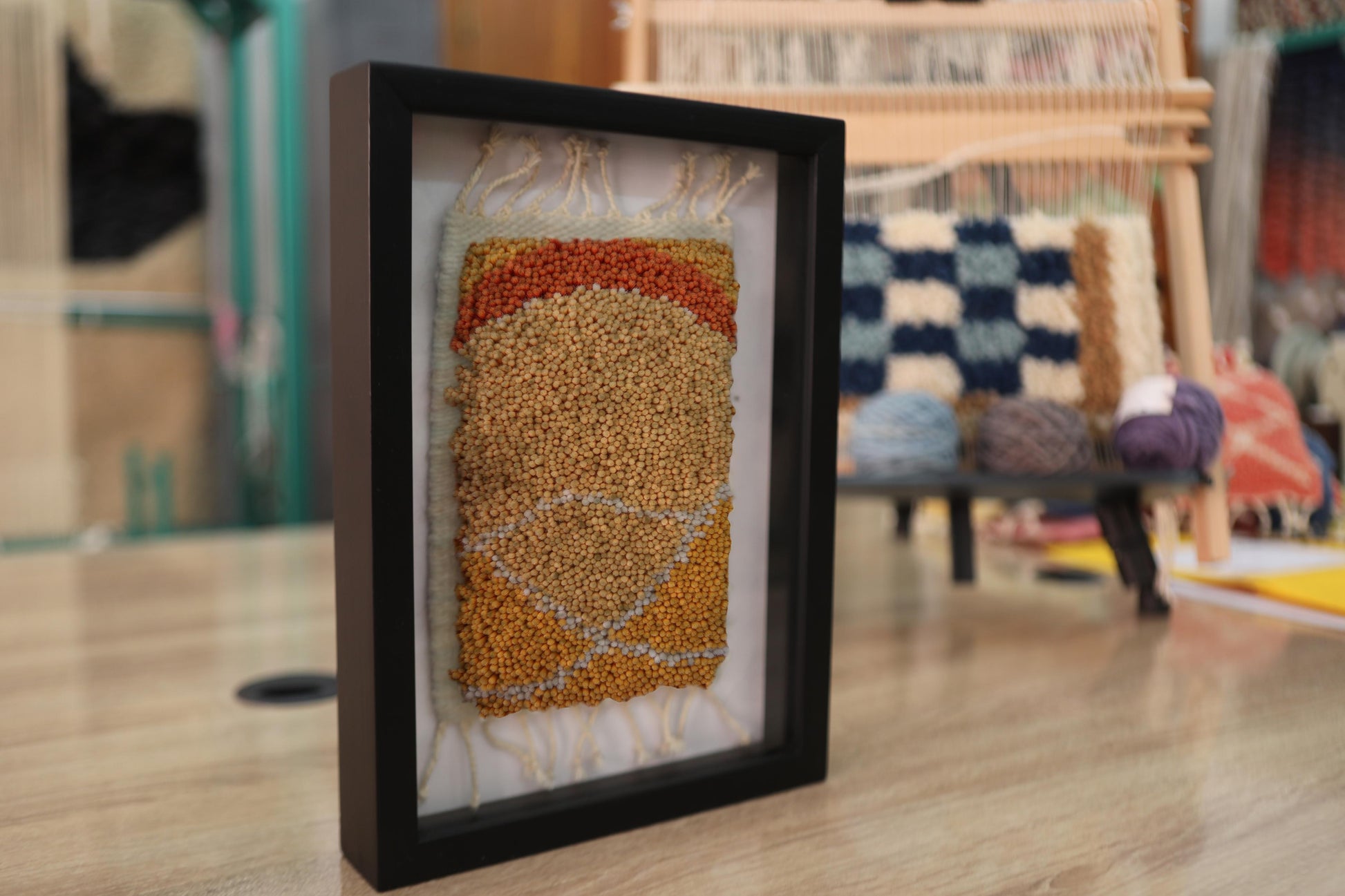 moroccan rug wall art, abstract moroccan textile, hand knotted mini rug, framed earth tone rug, artisanal rug decor, knot by knot weaving, tribal rug design, moroccan craftsmanship, wool wall hanging, 25x31 cm rug art

