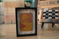 moroccan rug wall art, abstract sunset rug, hand knotted textile art, boho framed moroccan rug, orange yellow wall decor, knot by knot mini rug, artisan wool wall art, geometric moroccan design, framed wool tapestry, 25x31 cm handmade moroccan rug
