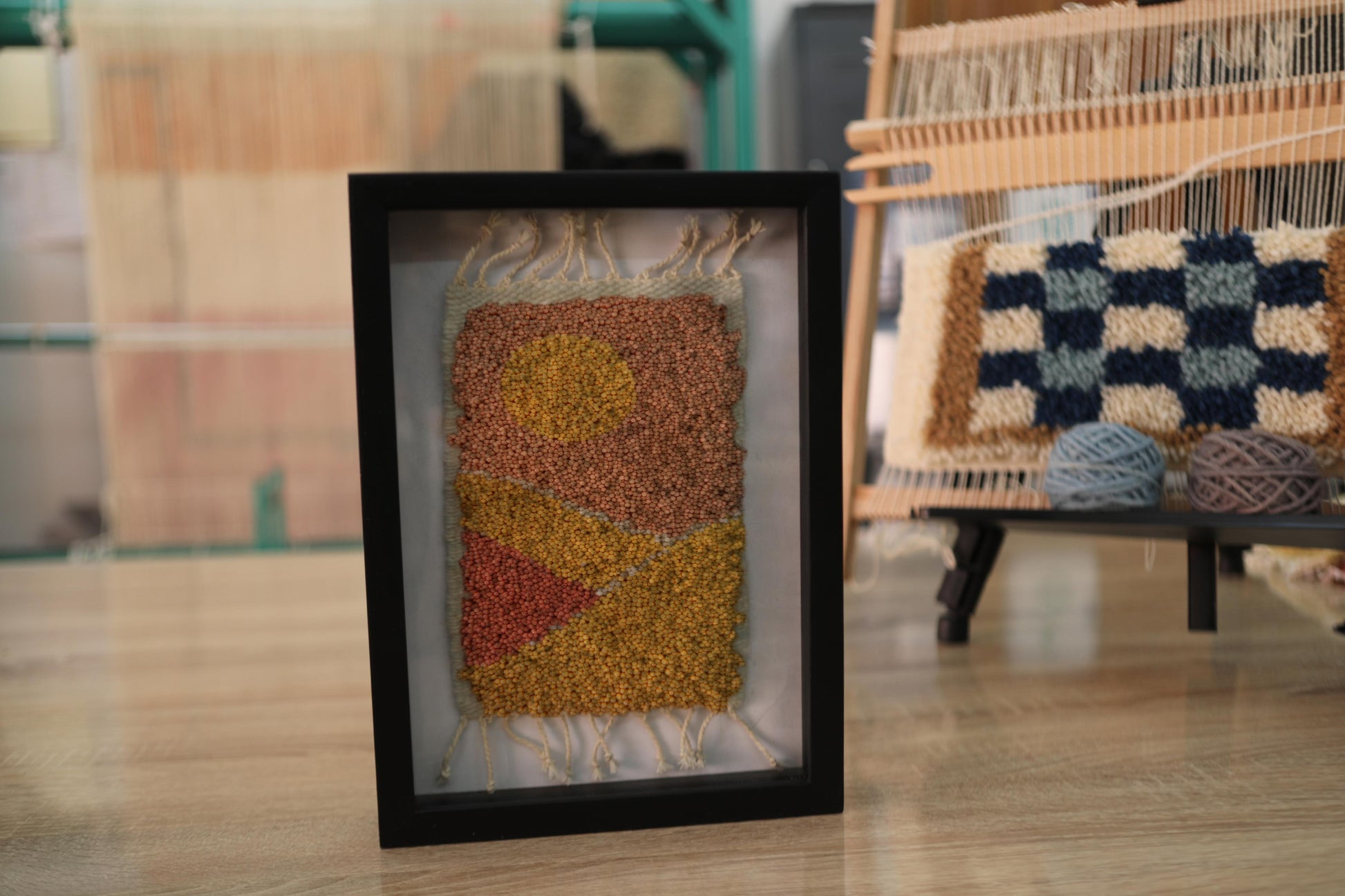moroccan rug wall art, abstract sunset rug, hand knotted textile art, boho framed moroccan rug, orange yellow wall decor, knot by knot mini rug, artisan wool wall art, geometric moroccan design, framed wool tapestry, 25x31 cm handmade moroccan rug

