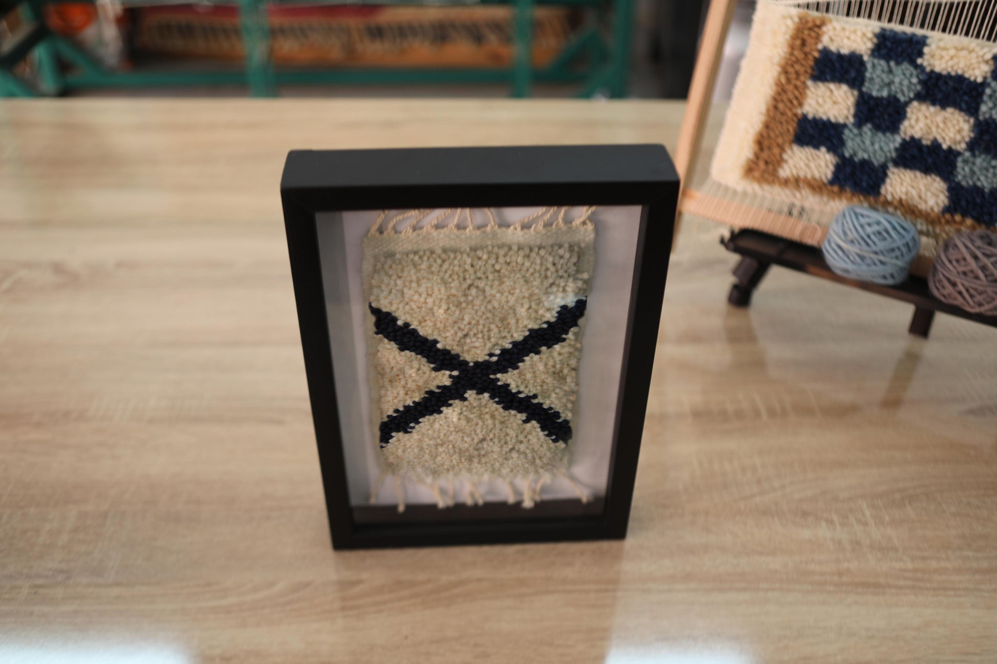 moroccan rug wall art, angled x rug, boho framed textile art, hand-knotted wall hanging, knot by knot moroccan rug, tribal wall decor, wool wall tapestry, small framed rug, bohemian decor piece, artisan rug wall art
