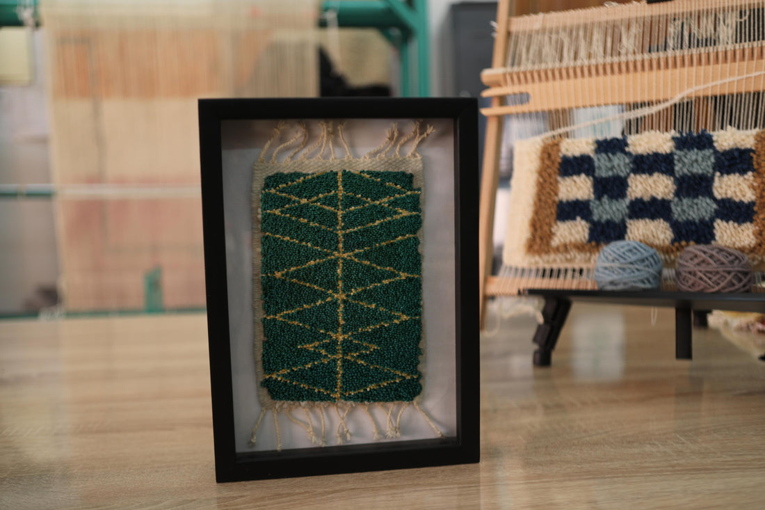 moroccan rug wall art, framed green moroccan rug, hand-knotted wool textile, small boho wall rug, mustard line spine pattern rug, green berber wall hanging, artisan knot by knot rug, moroccan home decor, 25x31 cm wool wall art, geometric moroccan textile

