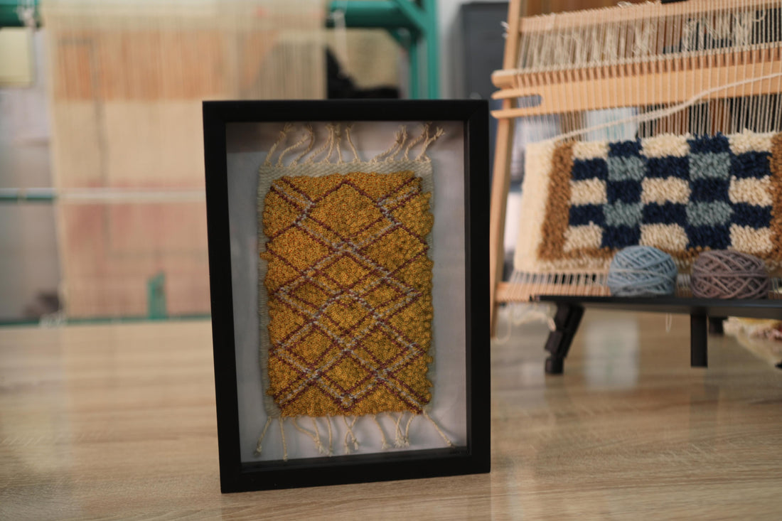 moroccan rug wall art, framed mini moroccan rug, diamond pattern tapestry, mustard yellow rug art, hand knotted wall hanging, small rug decor, knot by knot moroccan textile, boho home accent, artisan rug frame, 25x31 cm wool art
