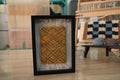 moroccan rug wall art, framed mini moroccan rug, diamond pattern tapestry, mustard yellow rug art, hand knotted wall hanging, small rug decor, knot by knot moroccan textile, boho home accent, artisan rug frame, 25x31 cm wool art
