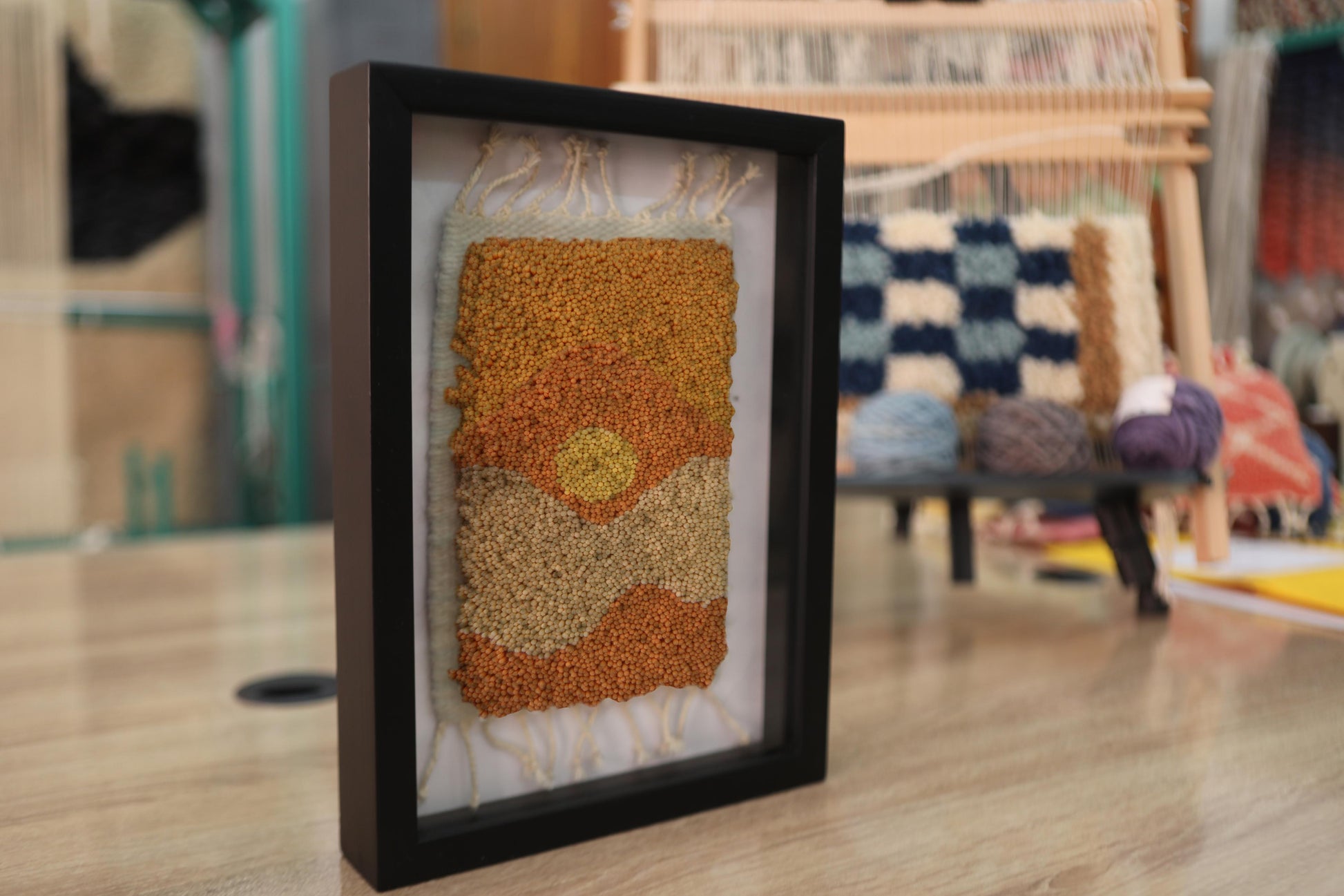 moroccan rug wall art, golden hour rug, abstract moroccan textile art, framed wool wall hanging, boho home decor, hand knotted rug artwork, knot by knot mini moroccan rug, warm toned wall art, 25x31 cm framed tapestry, artisan moroccan wool decor
