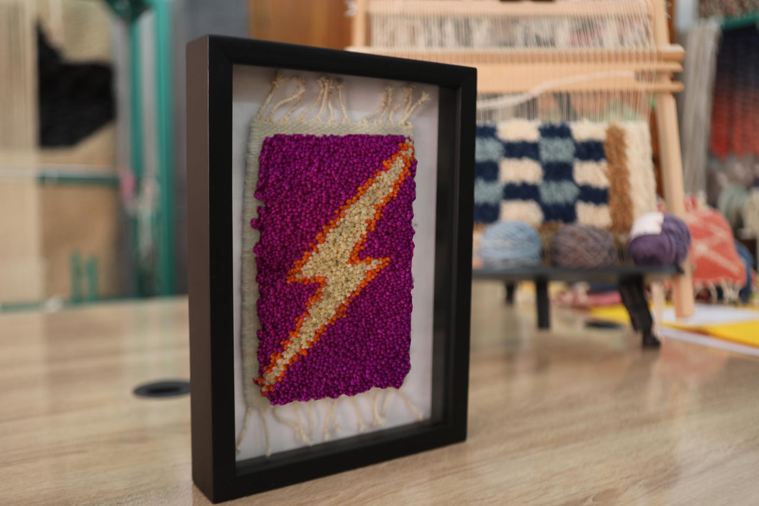 moroccan rug wall art, golden lightning bolt rug, purple pink wool tapestry, framed textile decor, hand-knotted rug art, knot by knot mini rug, lightning wall hanging
