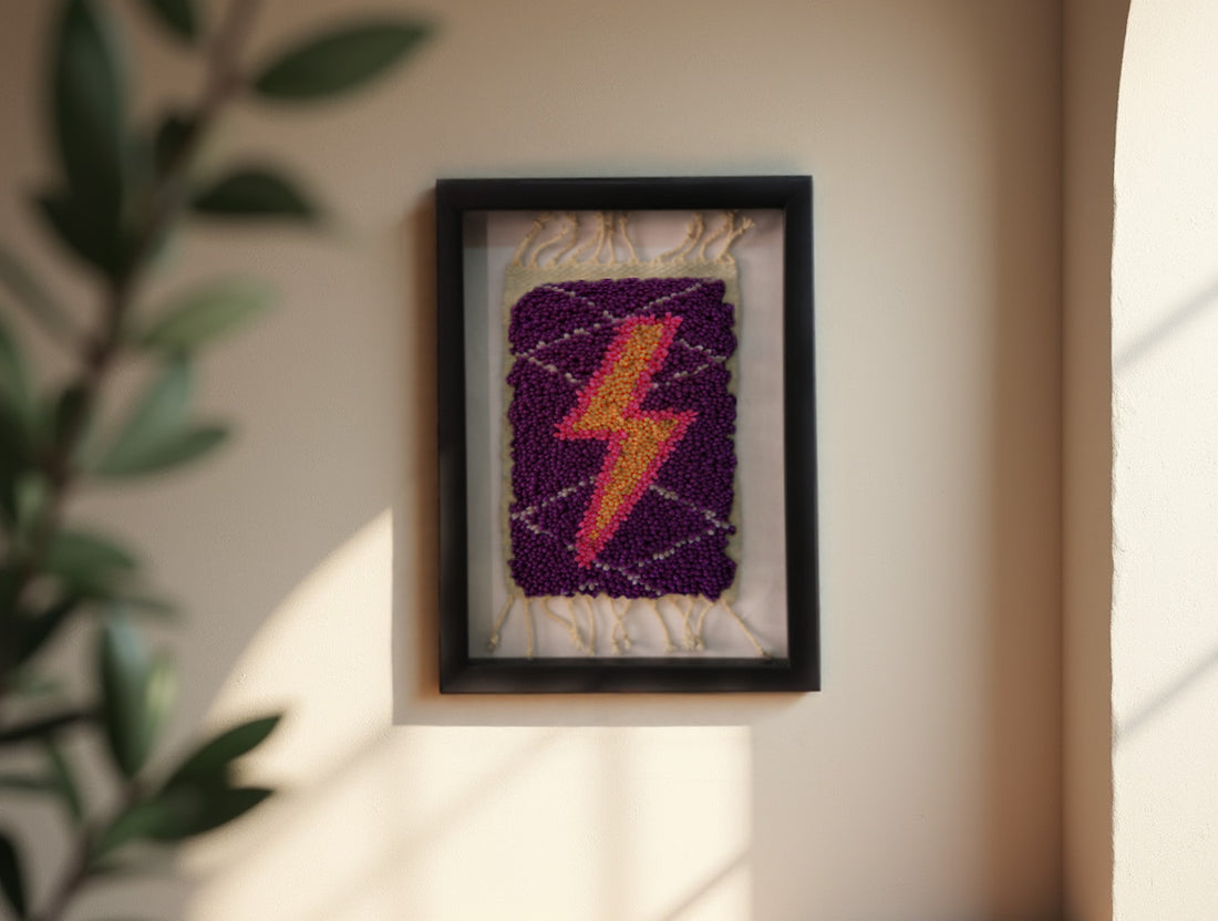 moroccan rug wall art, gradient lightning bolt textile, framed wool mini rug, hand-knotted lightning decor, pink orange yellow bolt art, purple wool tapestry, knot by knot wall hanging, moroccan lightning rug
