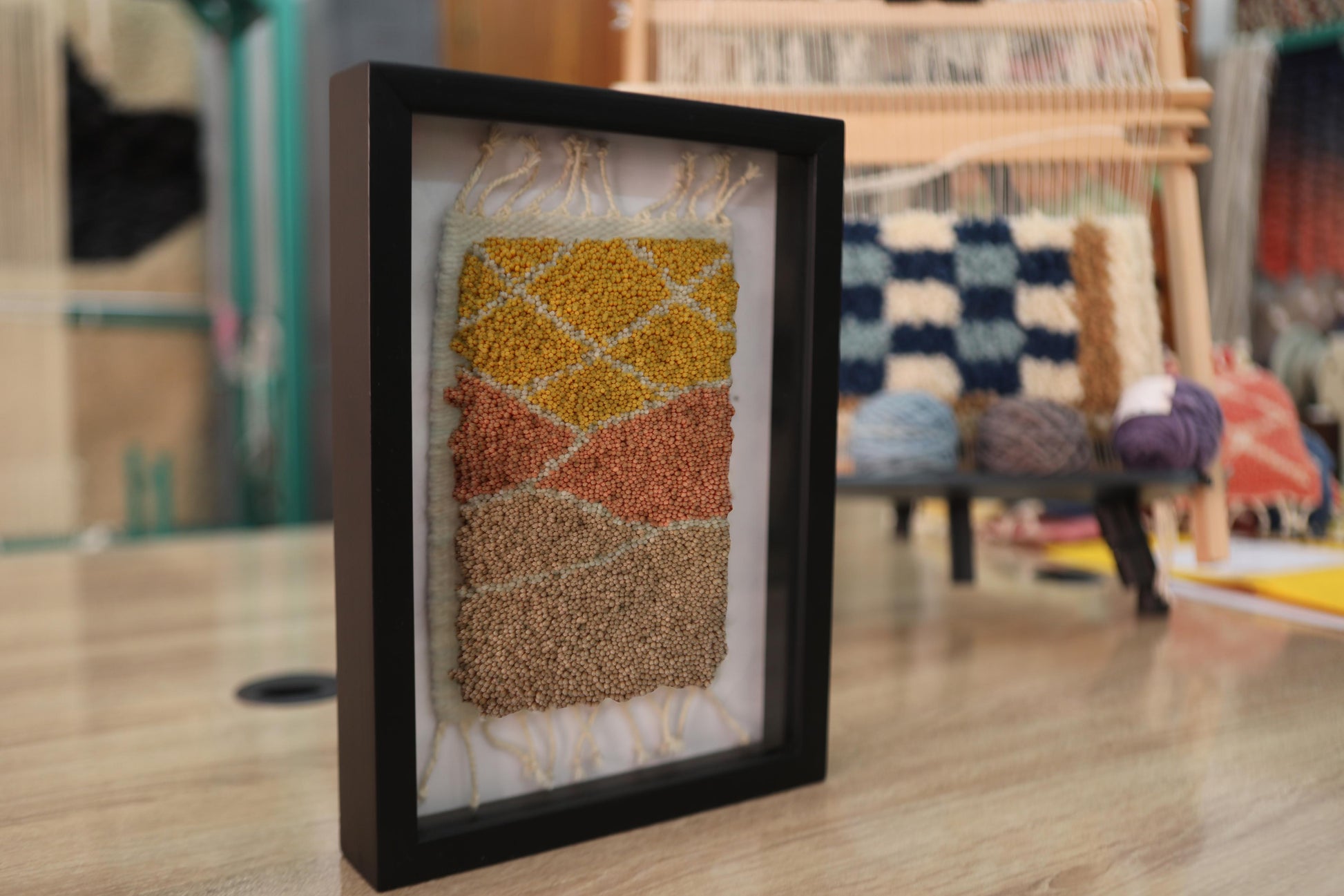 moroccan rug wall art, hand-knotted mini tapestry, framed moroccan wool rug, abstract landscape wall hanging, boho decor, artisan moroccan textile, knot by knot rug, geometric wool artwork, desert colors wall art, 25x31 cm moroccan tapestry