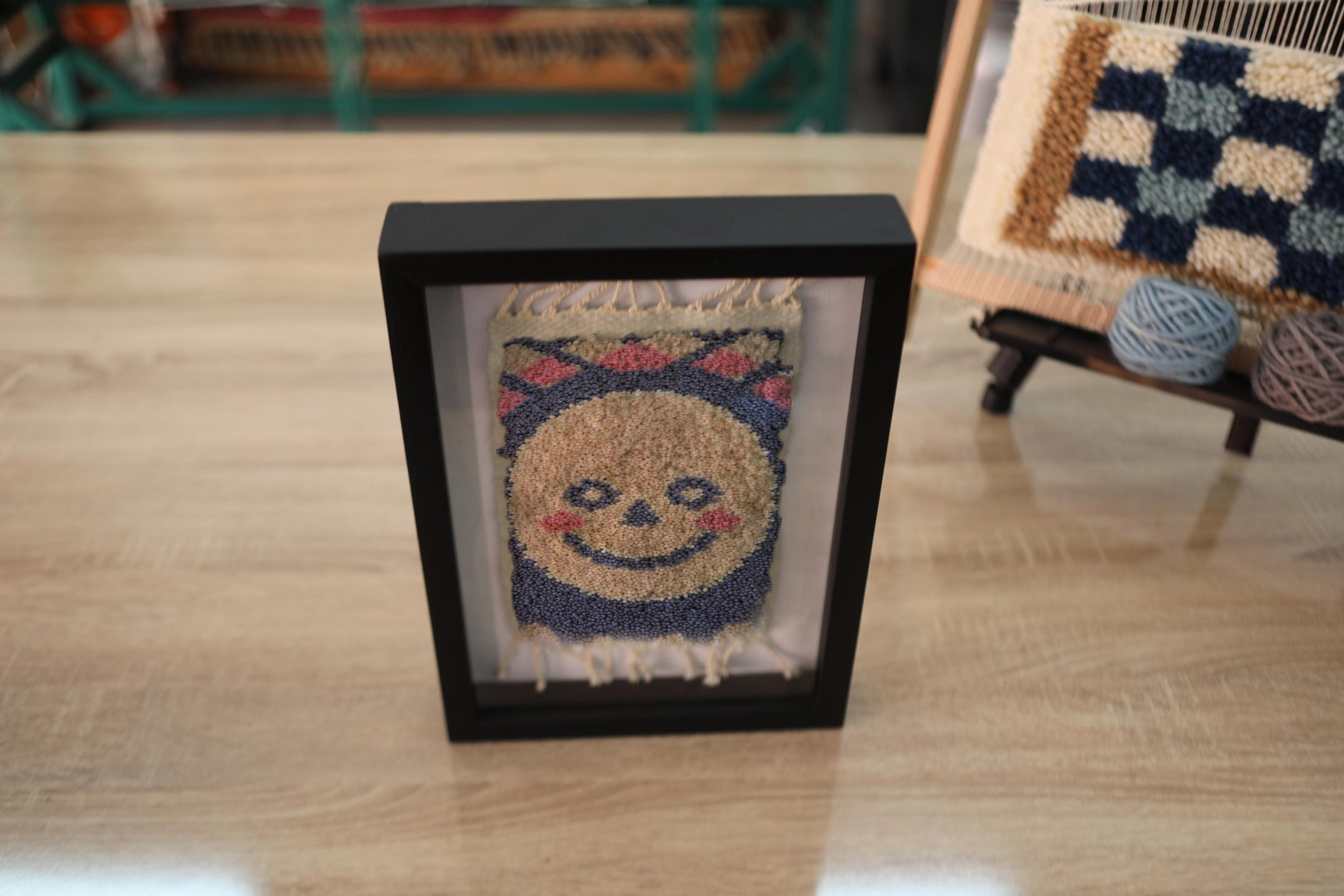 moroccan rug wall art, hand-knotted wool sun rug, smiling face tapestry, happy face decor, boho sun mini rug, framed textile art, handmade wall hanging, wool smiley face rug, knot by knot rug, 25x31 cm

