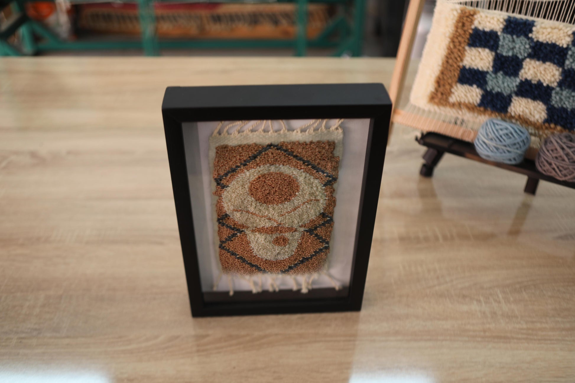moroccan rug wall art, hand knotted abstract rug, wool eye design, framed boho decor, artisan moroccan textile, geometric knot by knot rug, small rug wall hanging, 25x31 cm rug
