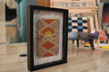 moroccan rug wall art, hand knotted moroccan rug, rising sun rug art, geometric diamond textile, framed boho decor, knot by knot rug, artisan moroccan weaving, 25x31 cm wall hanging, earthy tone rug, desert sun decor
