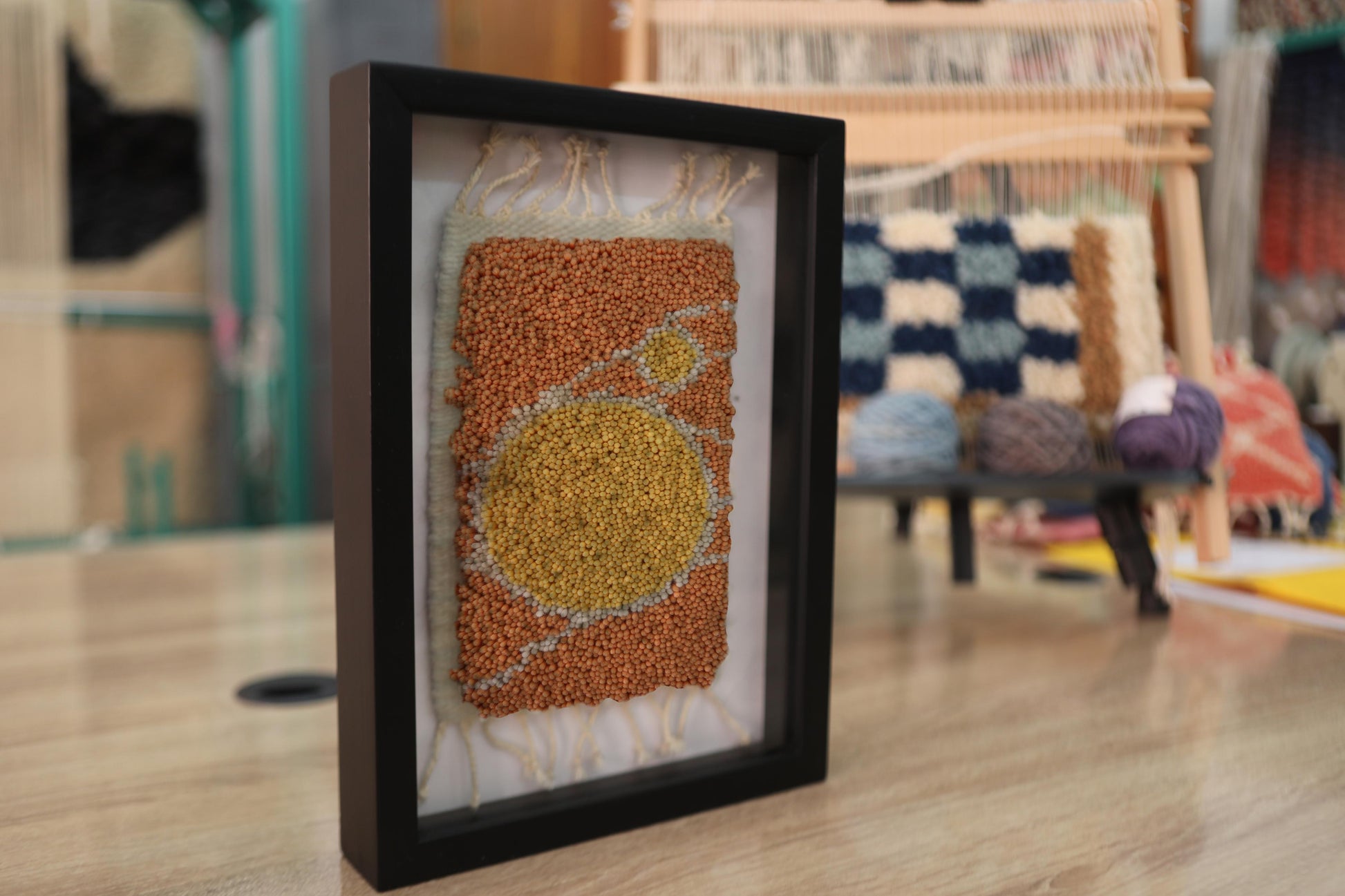 moroccan rug wall art, hand knotted moroccan rug, sun circle rug pattern, abstract moroccan textile, framed moroccan decor, boho wall hanging, yellow ochre rug art, knot by knot weaving, artisan moroccan wall decor, 25x31 cm
