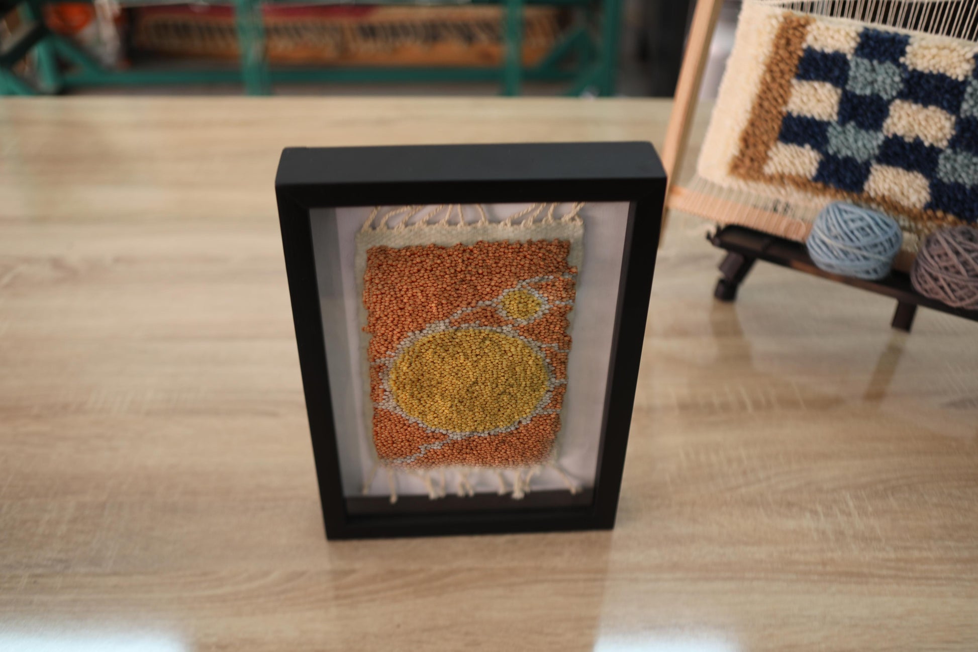 moroccan rug wall art, hand knotted moroccan rug, sun circle rug pattern, abstract moroccan textile, framed moroccan decor, boho wall hanging, yellow ochre rug art, knot by knot weaving, artisan moroccan wall decor, 25x31 cm

