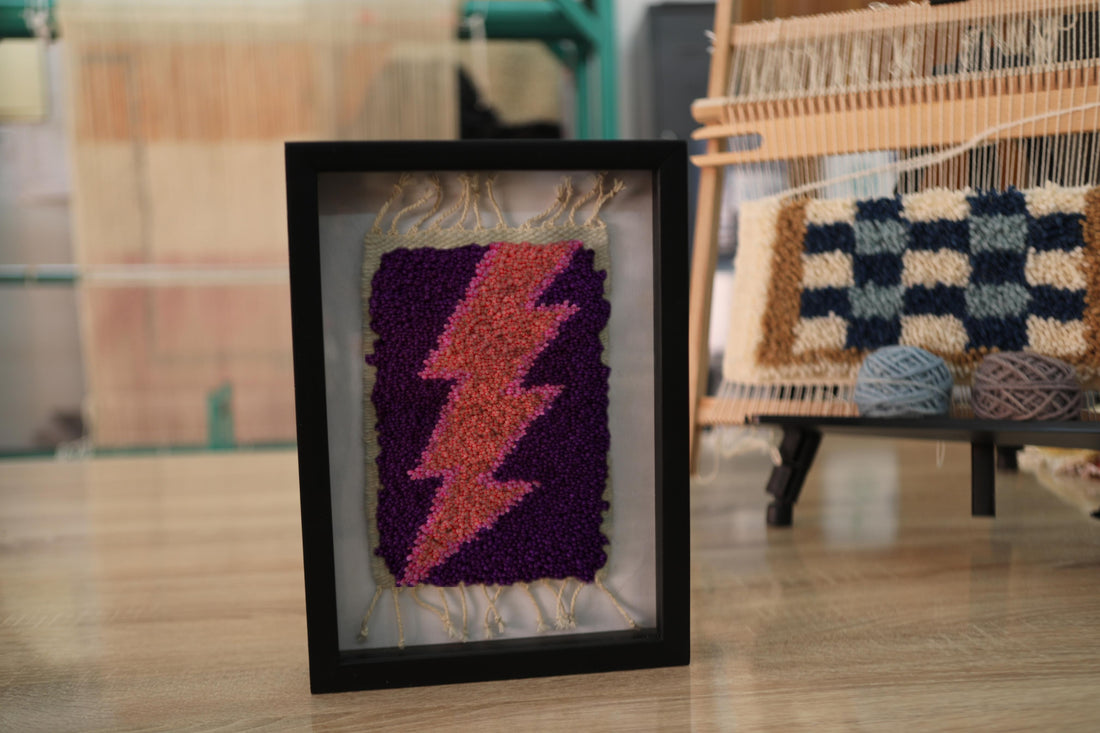 moroccan rug wall art, pink lightning bolt rug, purple wool framed rug, hand-knotted tapestry, textile lightning decor, mini rug art, knot by knot moroccan craft
