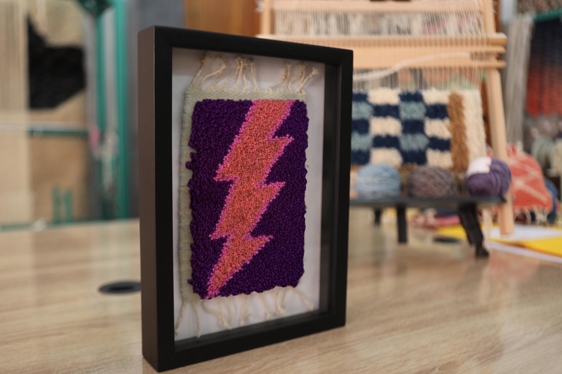 moroccan rug wall art, pink lightning bolt rug, purple wool framed rug, hand-knotted tapestry, textile lightning decor, mini rug art, knot by knot moroccan craft
