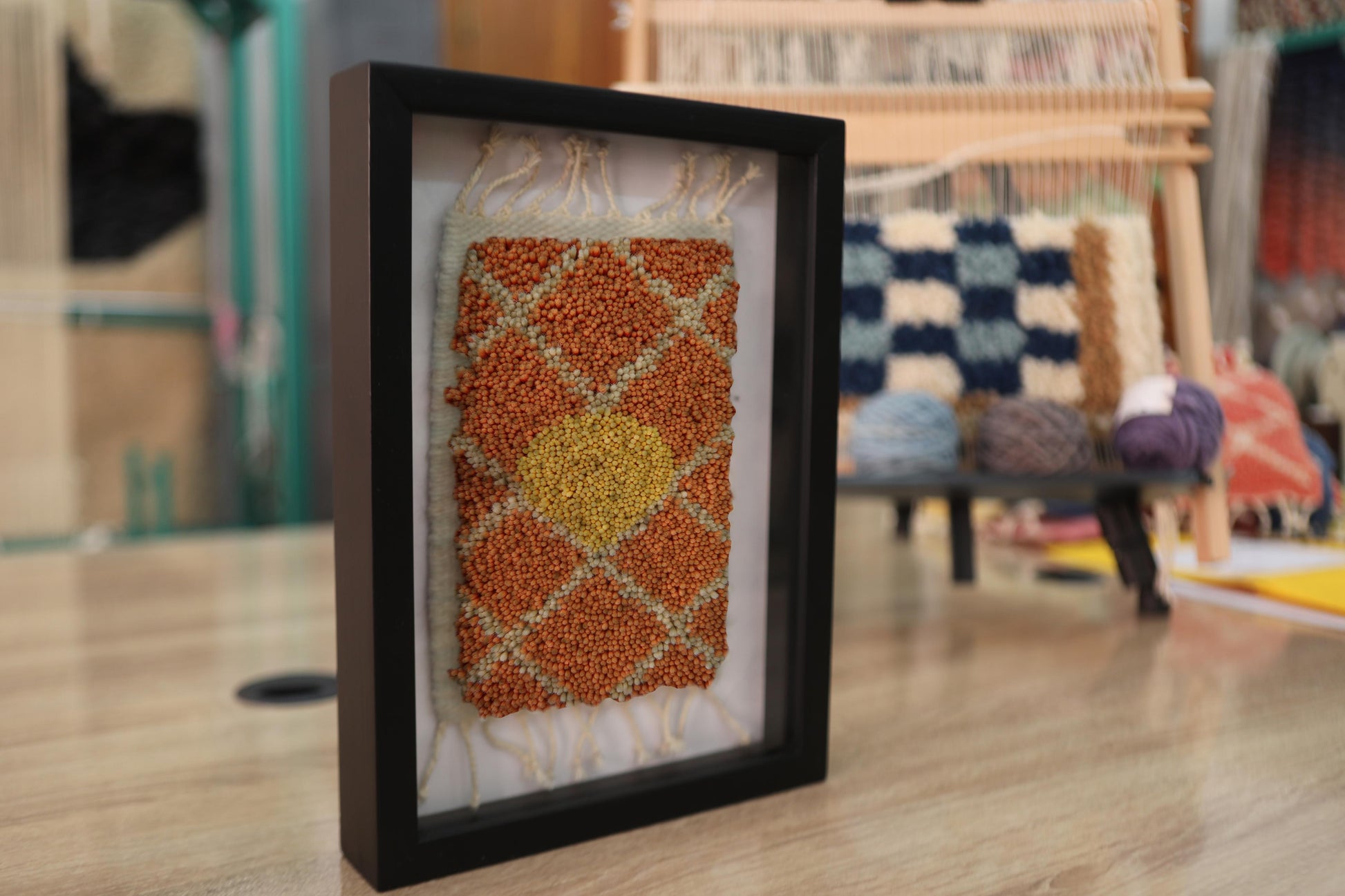 moroccan rug wall art, sun medallion rug, framed mini moroccan tapestry, orange yellow moroccan rug, hand knotted textile art, boho wall decor, artisan wool rug, knot by knot rug, 25x31 cm framed rug, berber style mini rug
