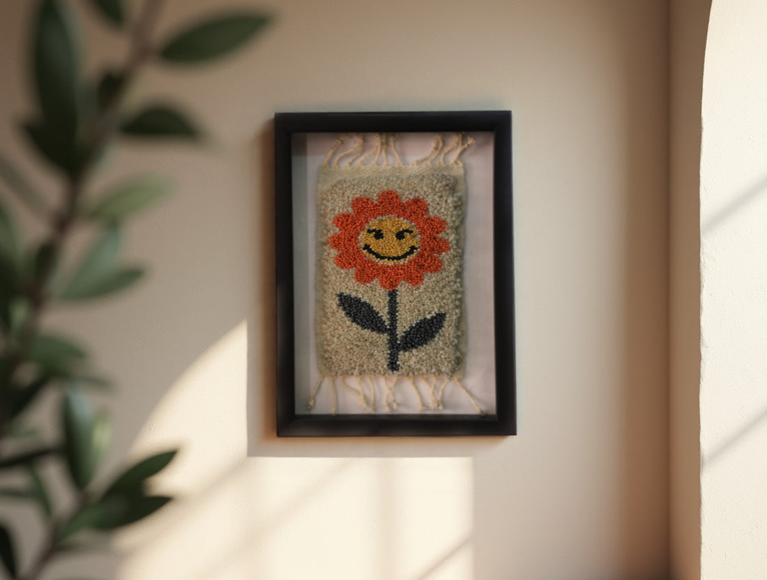 orange flower rug, moroccan rug wall art, hand-knotted wool tapestry, smiling flower textile, framed wool wall decor, mini moroccan rug, boho wool wall hanging, cheerful flower rug art, 25x31 cm framed textile, knot by knot rug design
